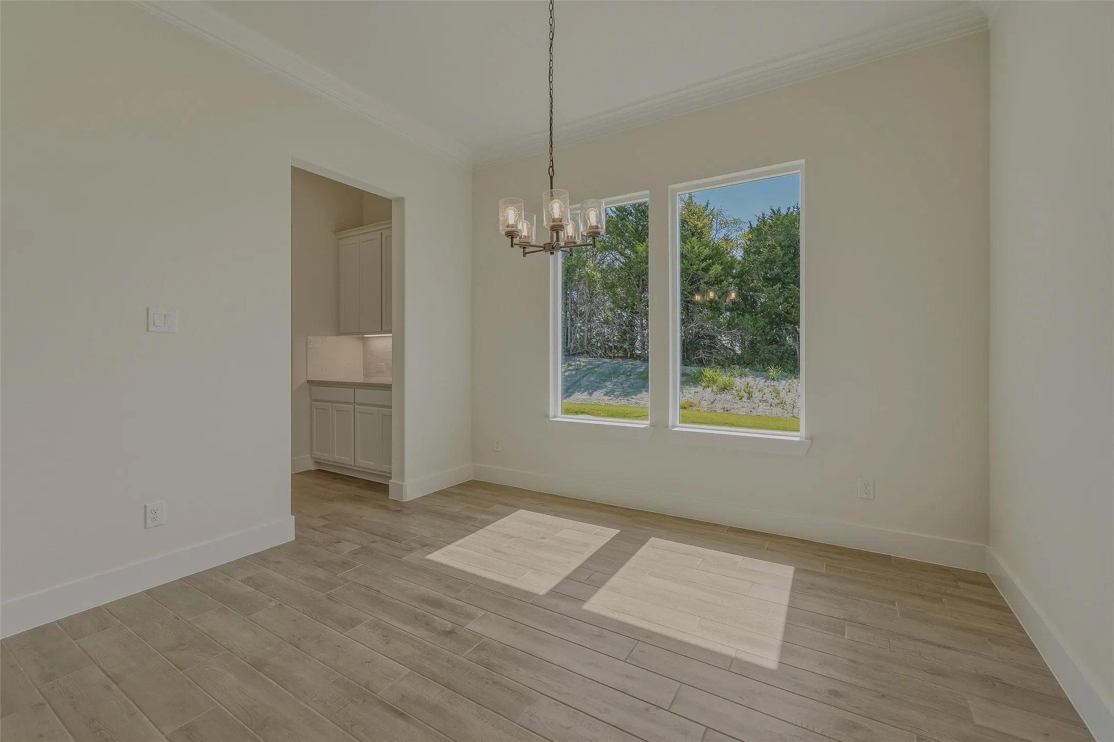 Neutral-toned interior with wood-finish flooring