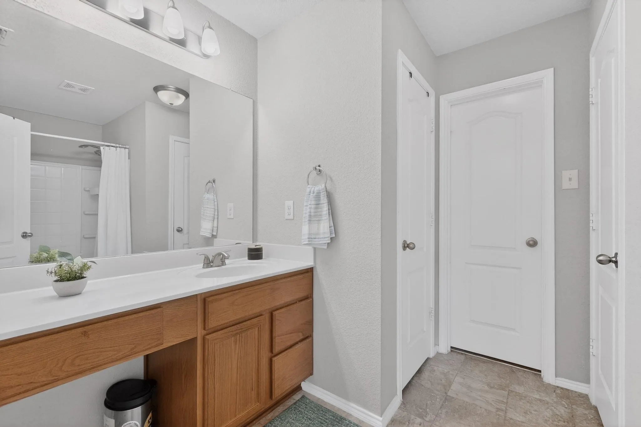 Full bath featuring vanity and a shower with curtain