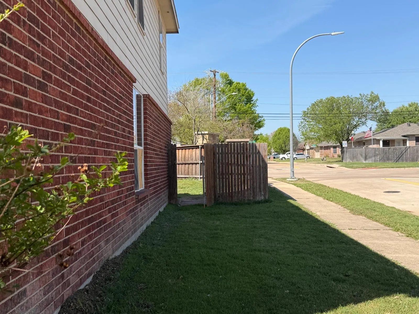 View of yard featuring a residential view and a gate