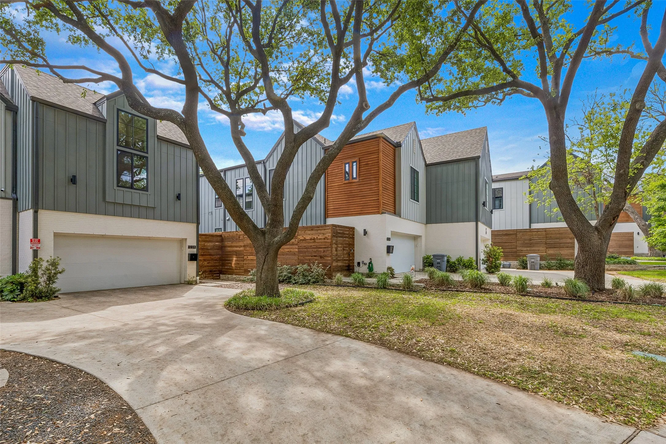 Contemporary home with a garage and concrete driveway