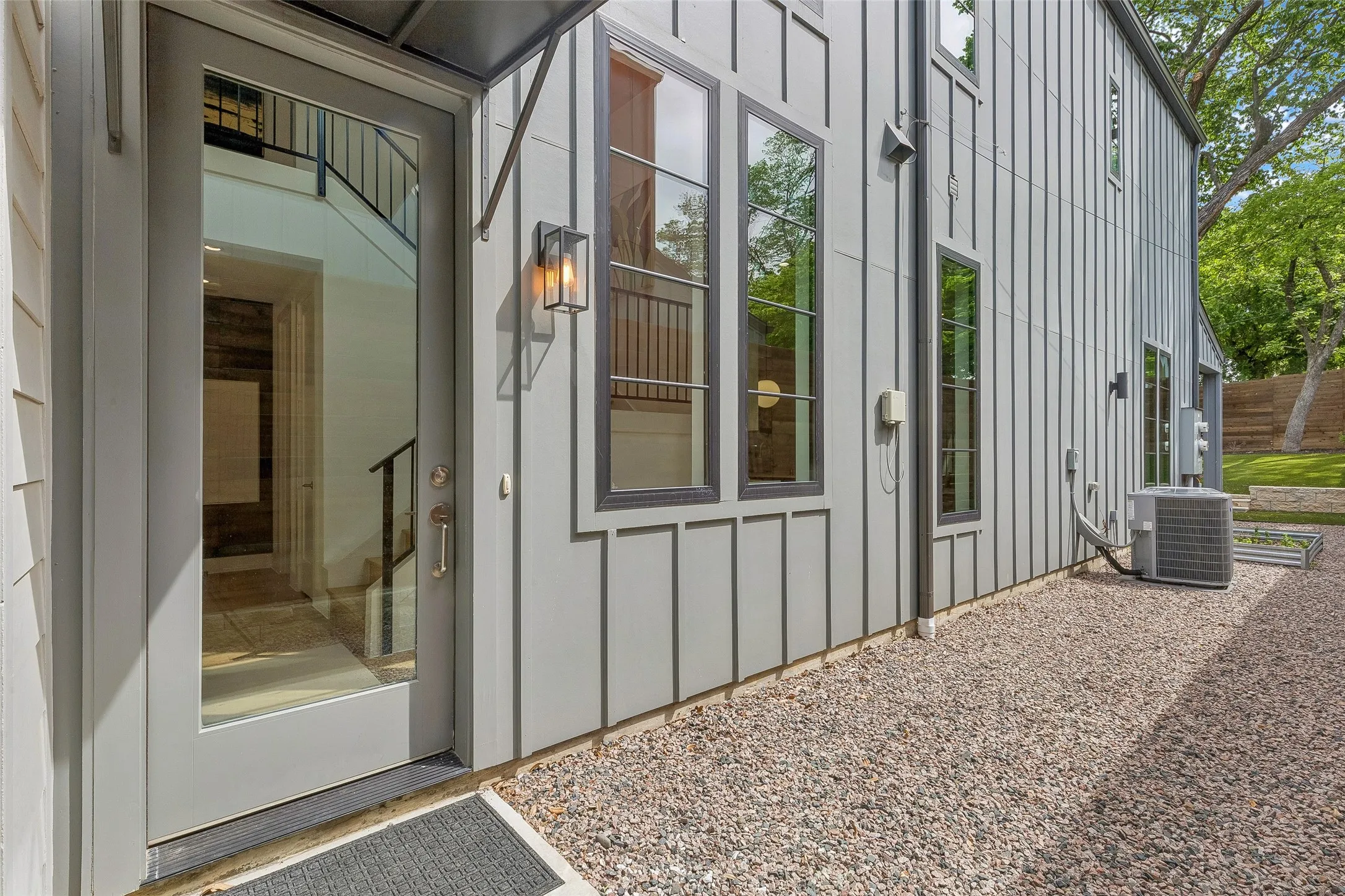 Doorway to property with board and batten siding