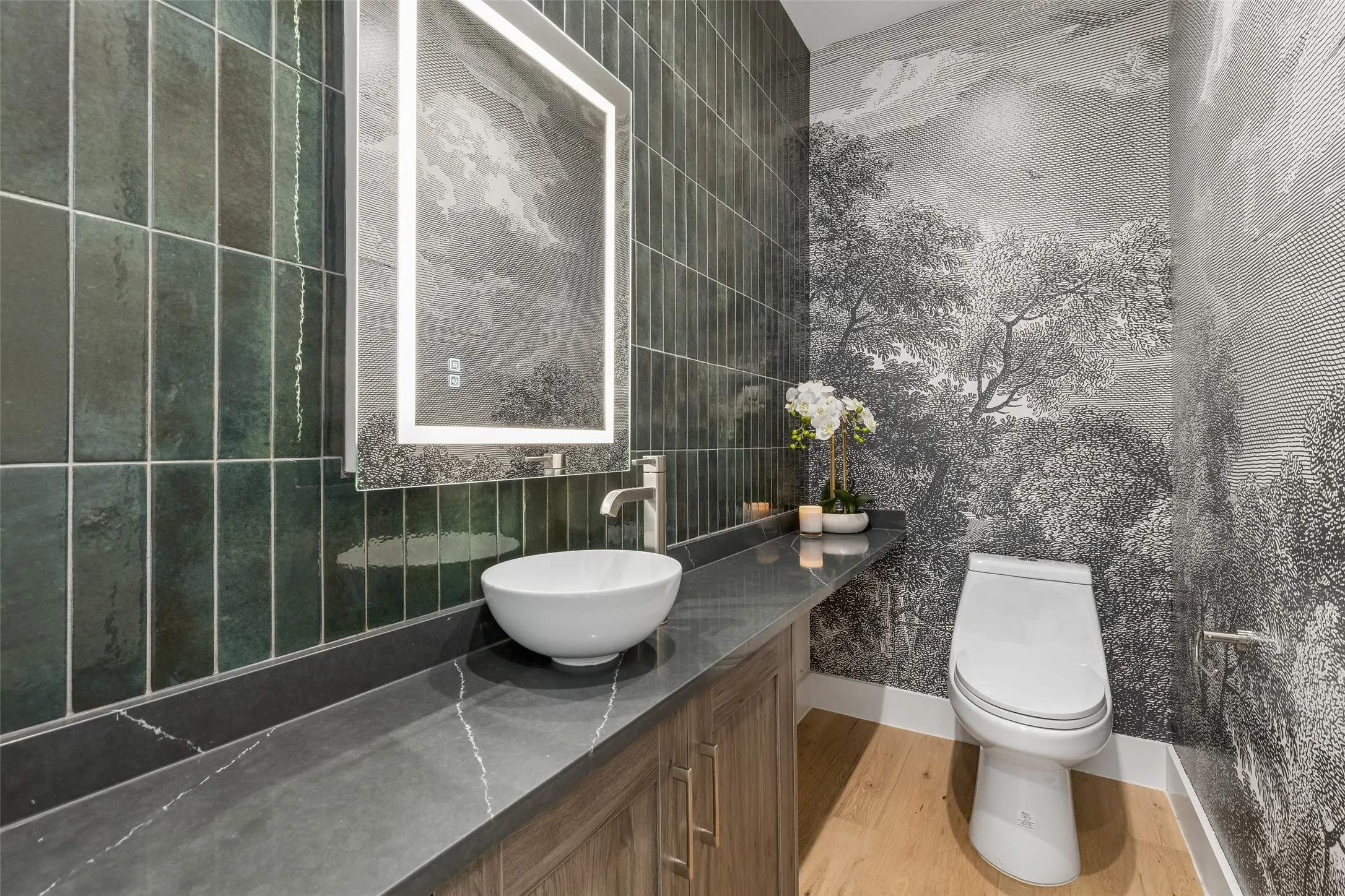 Bathroom with vanity and light wood finished floors
