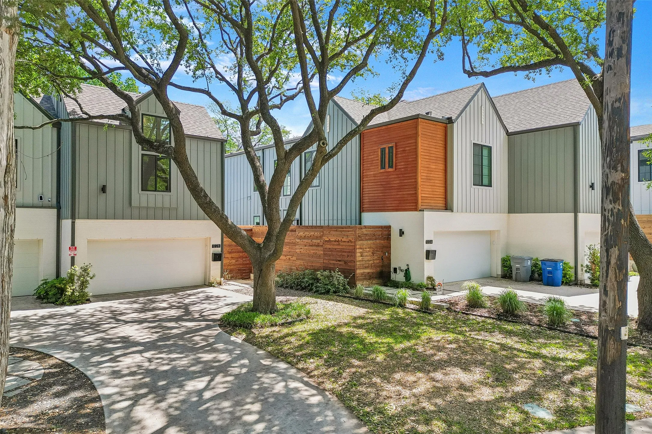 View of front of house featuring an attached garage and driveway