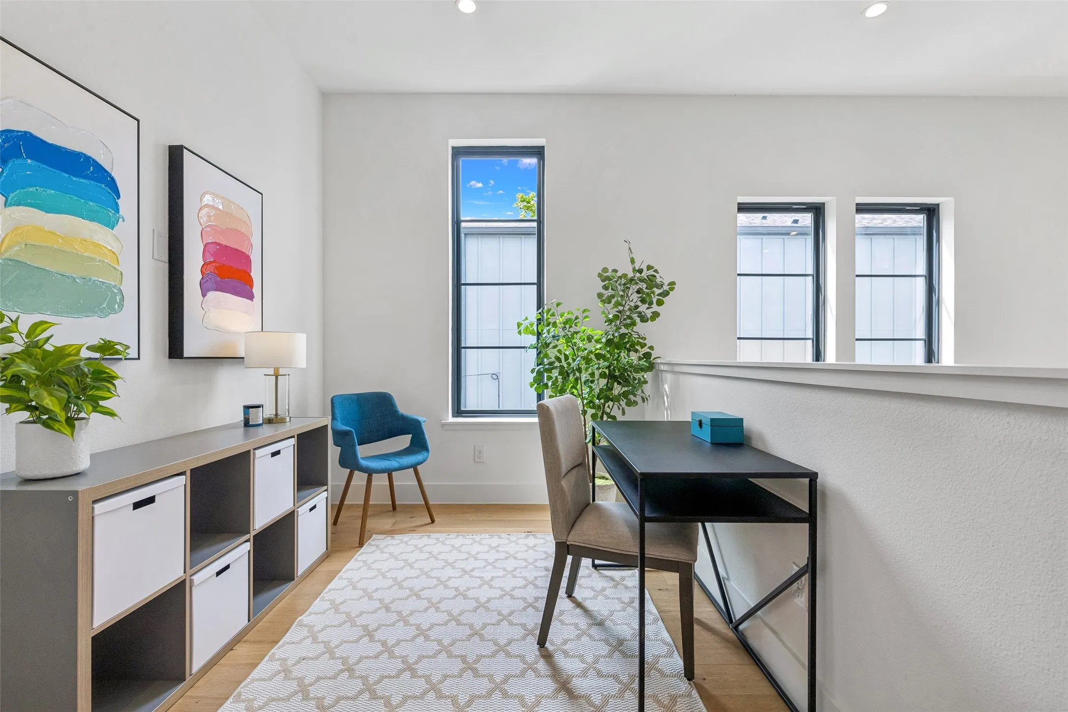 Home office featuring light wood finished floors and recessed lighting
