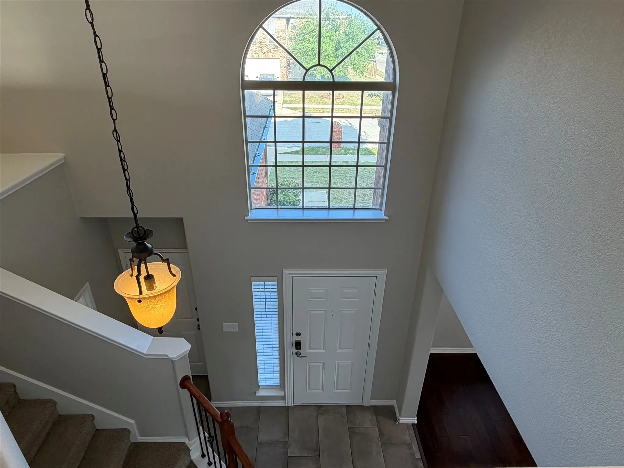 Entryway with stairs and baseboards
