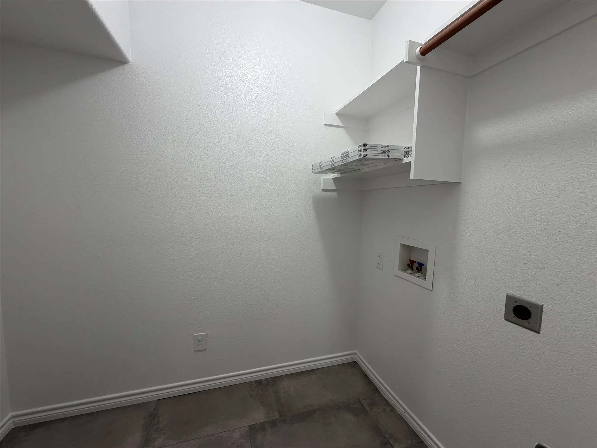 Laundry area with washer hookup and electric dryer hookup