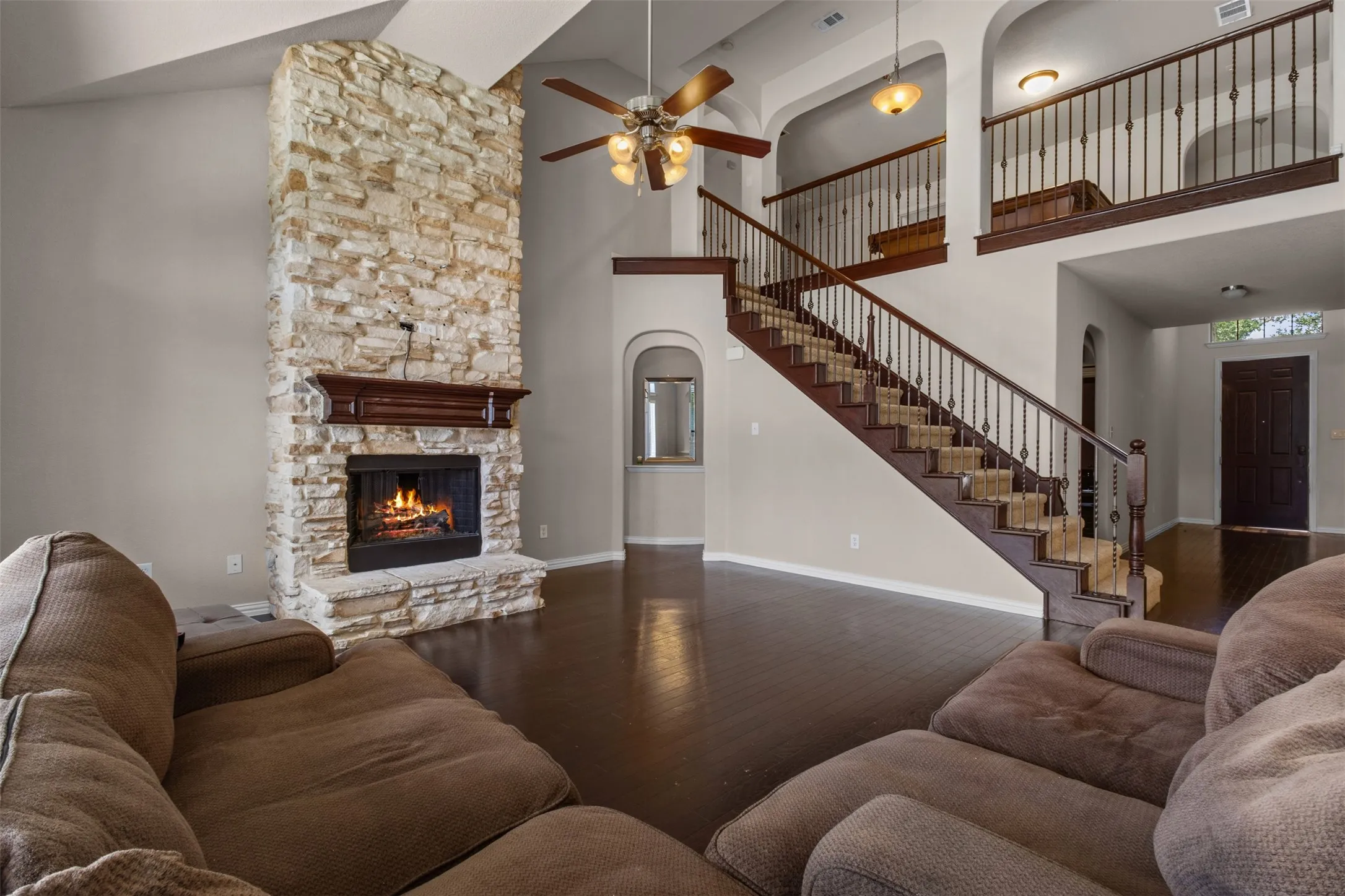 High ceiling living room with fireplace