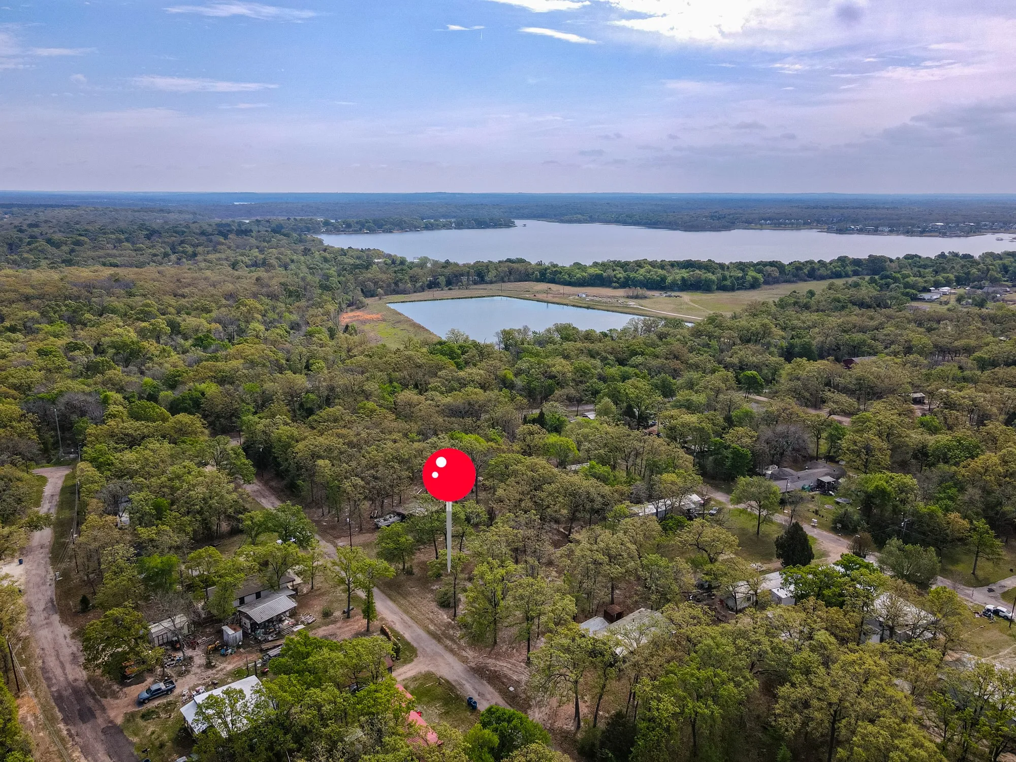 Bird's eye view of a nearby body of water and a forest