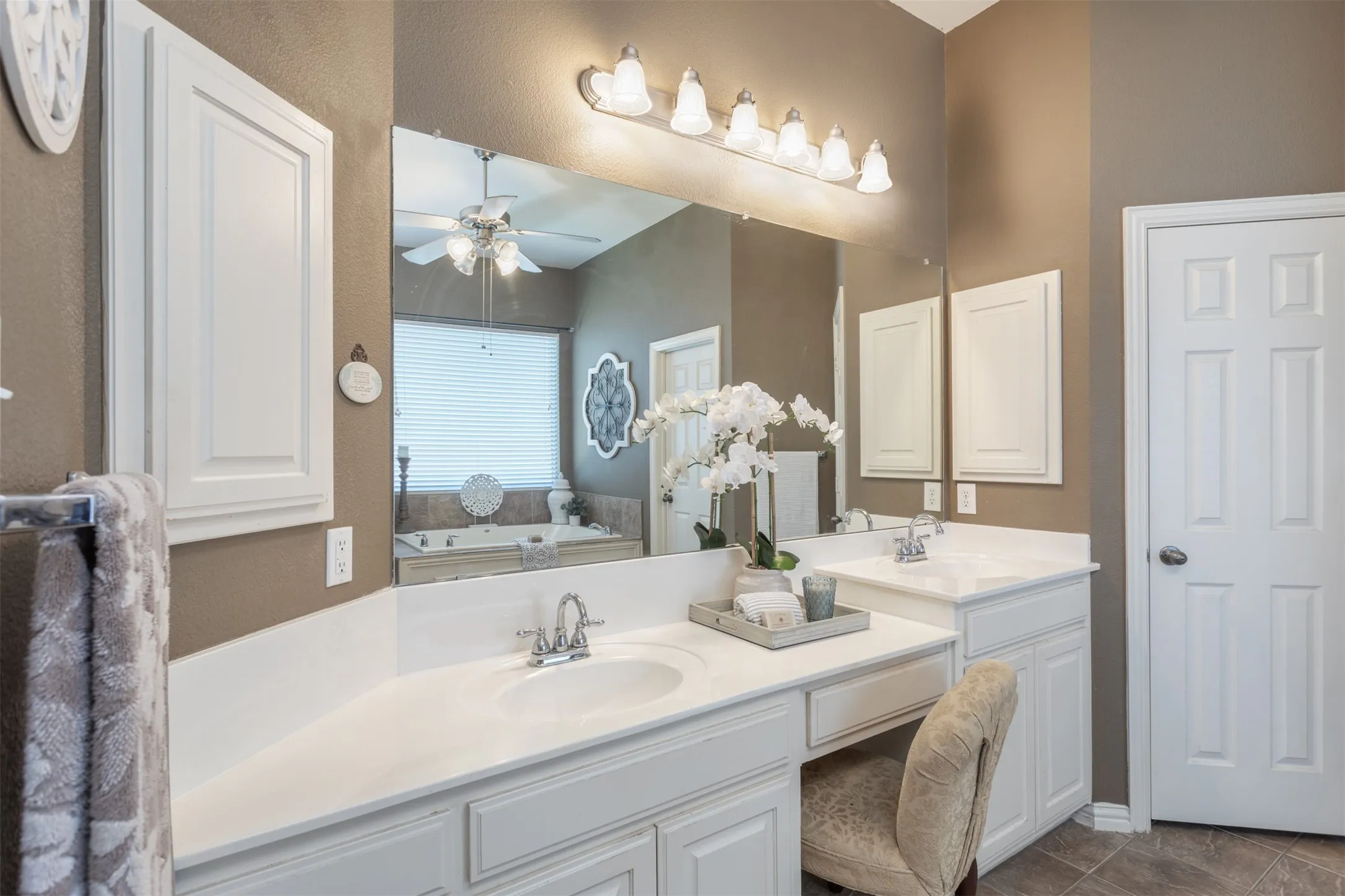 Experience luxury in this spacious main bathroom.