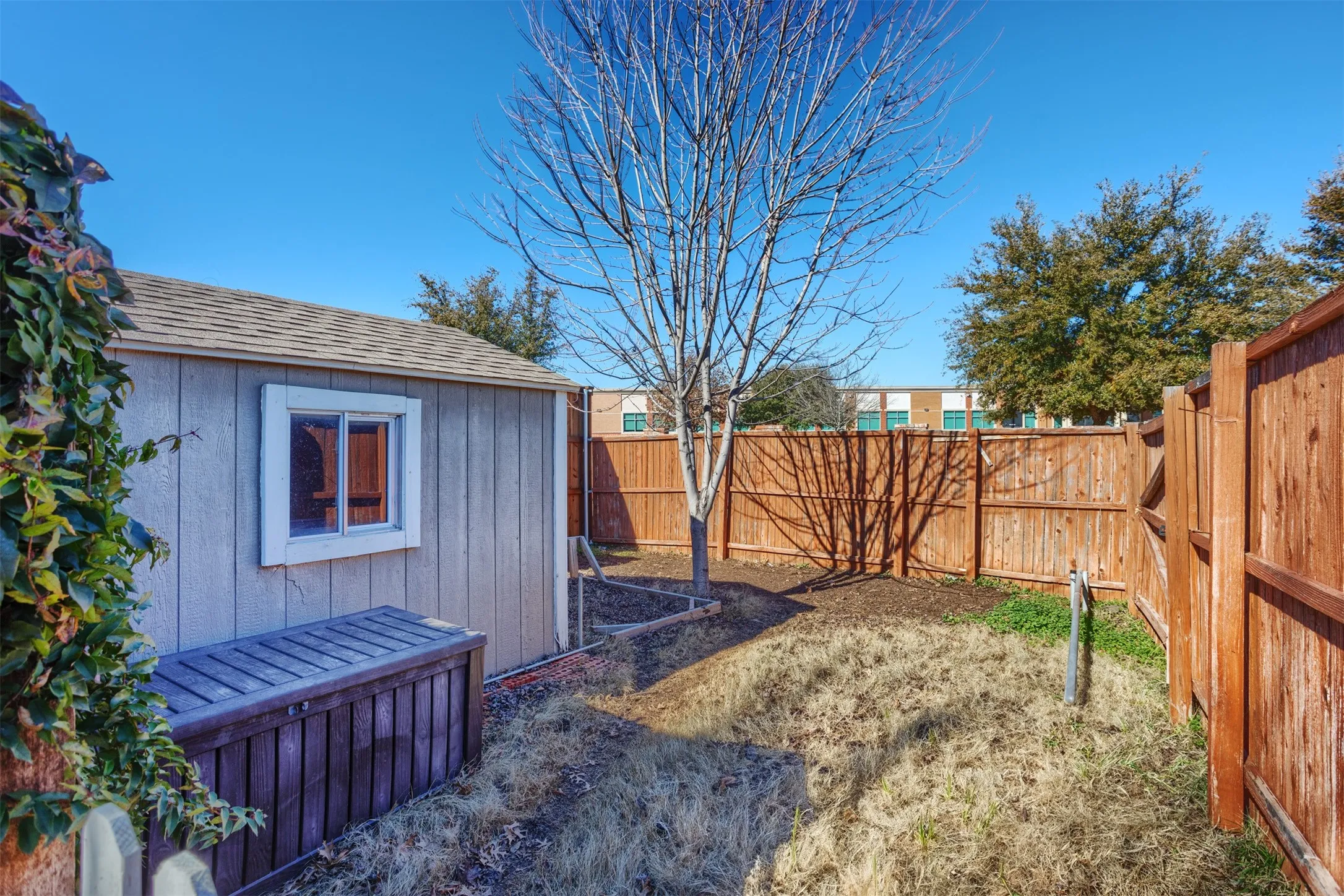 Storage shed and an extended backyard area! So great!