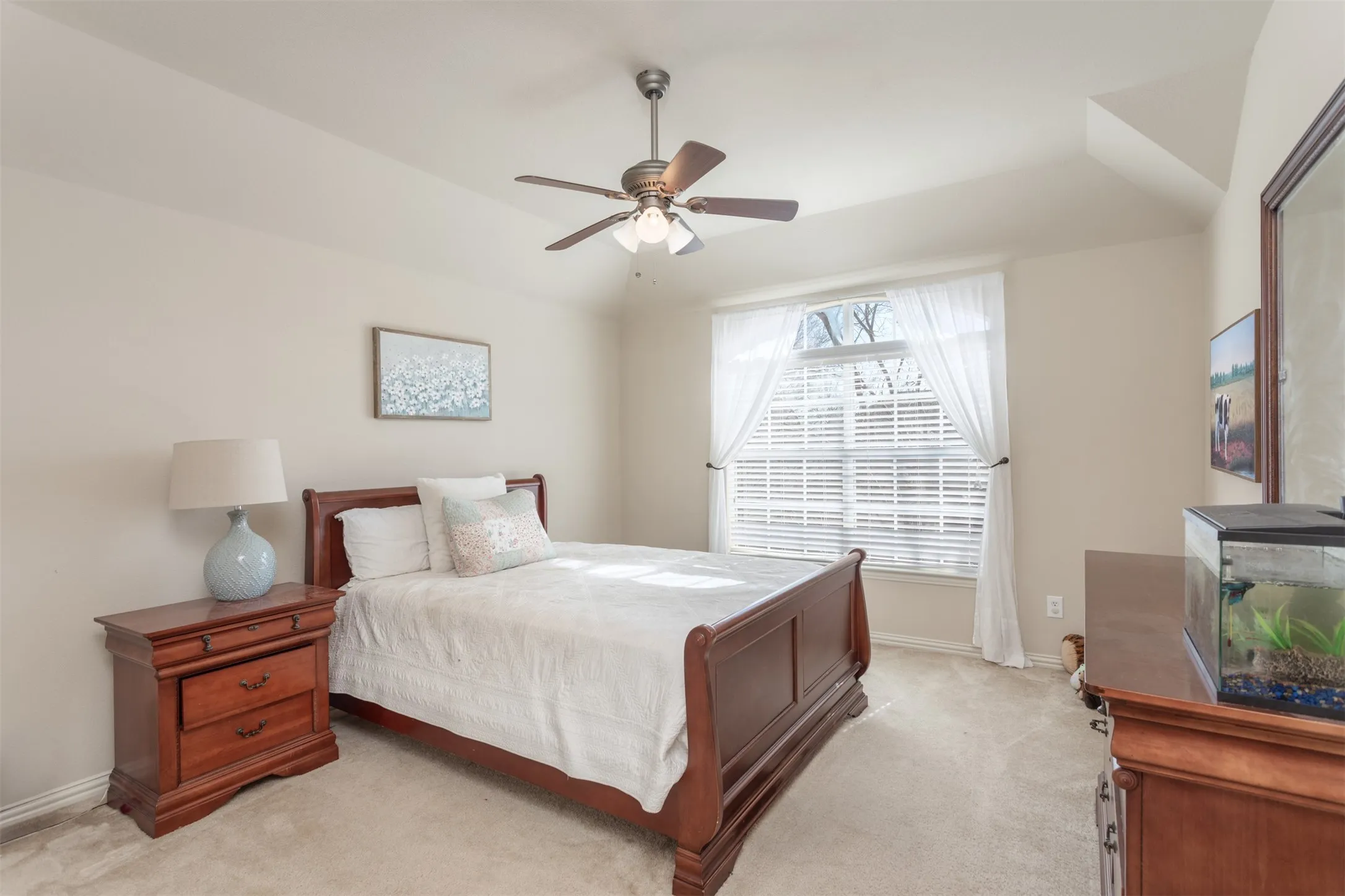 Large window and closet in this spacious secondary bedroom