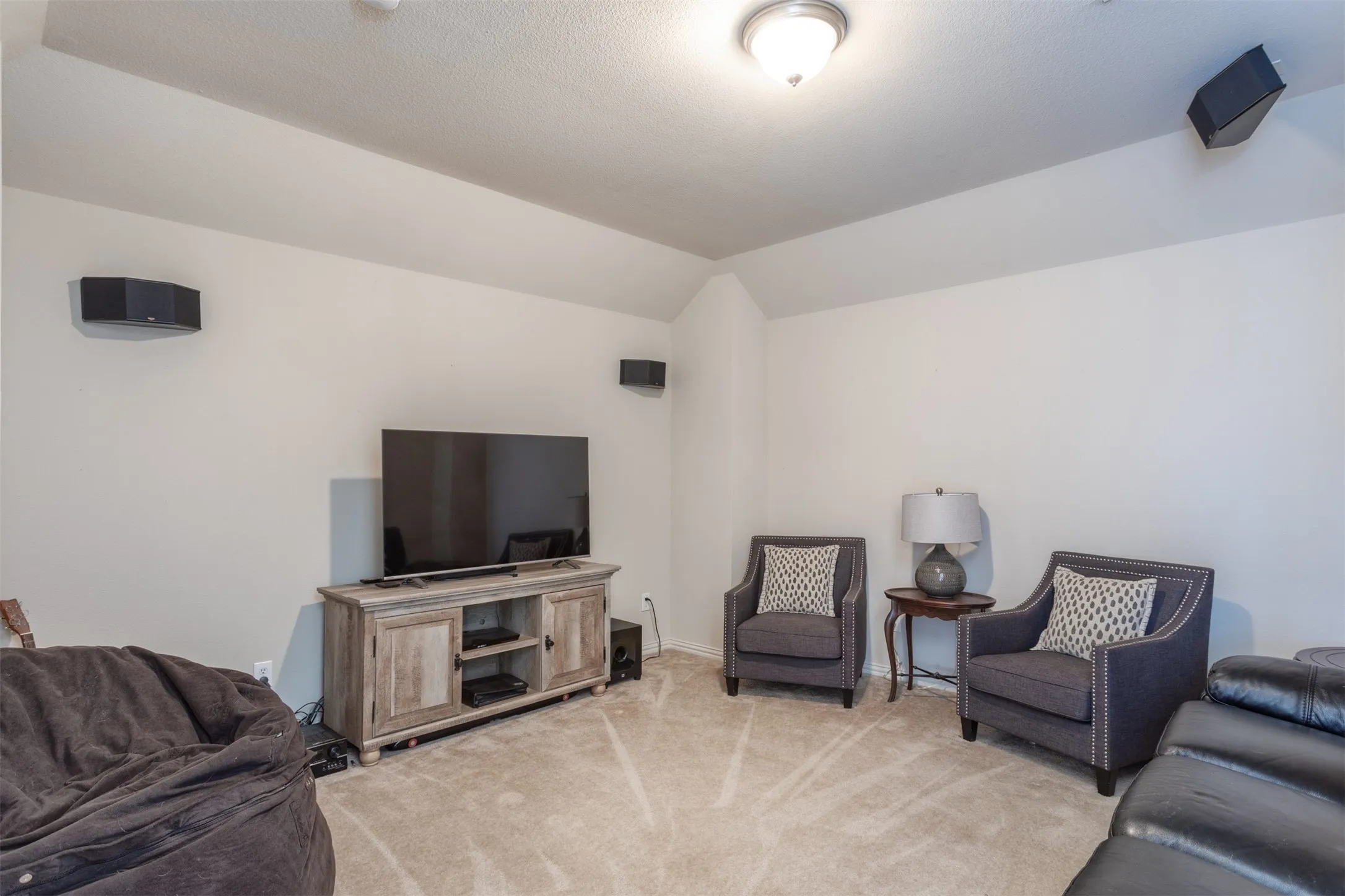 A fabulous media room for those movie nights or watching the big game! Now, that is an entertainer’s dream! What else could you possibly want in a home?! There’s even an upstairs balcony to enjoy the fresh air outside.