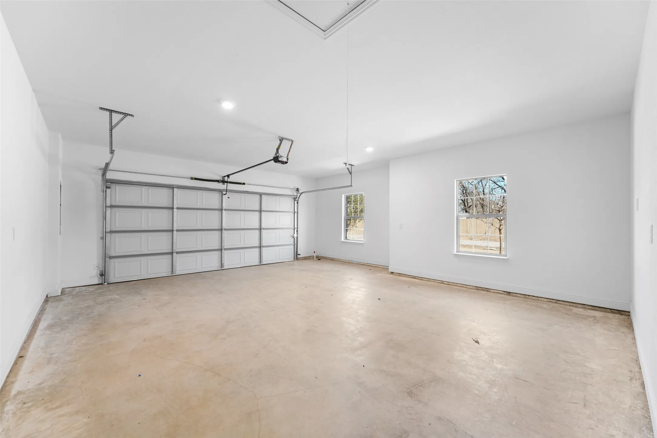 Garage featuring recessed lighting