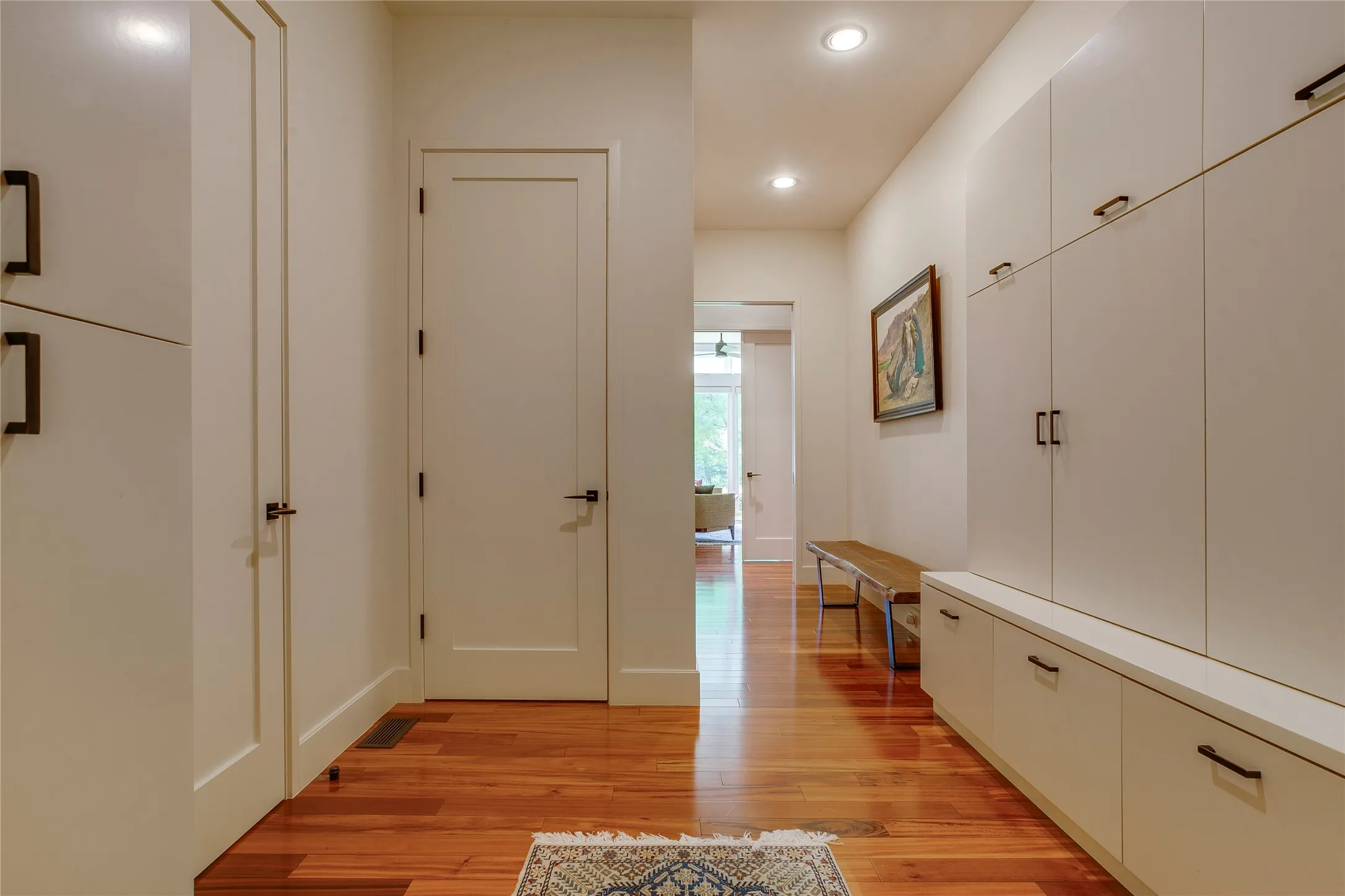 Downstairs mud room with second laundry room and storage closet.
