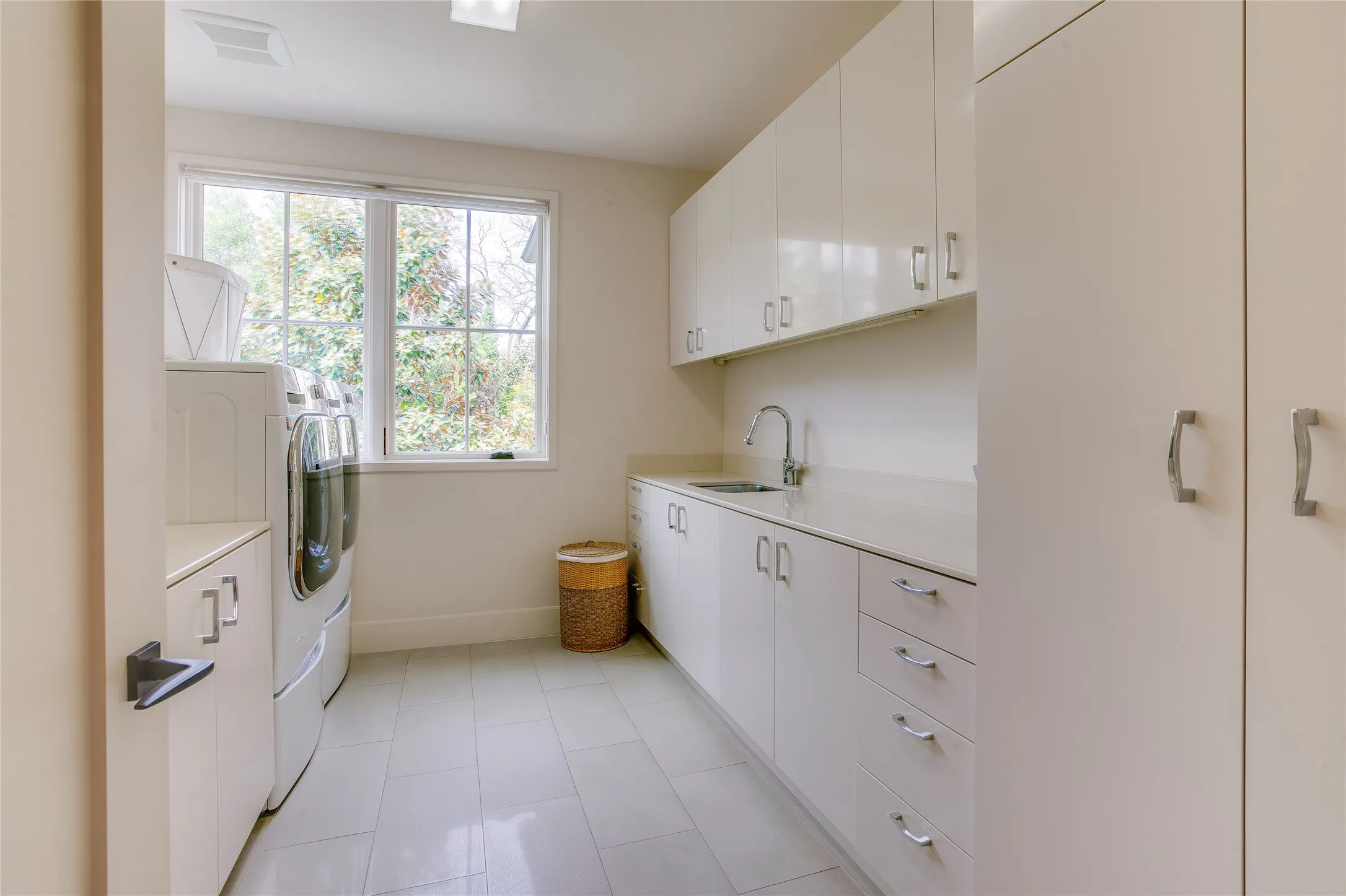 One of two utility rooms.  Located on the second floor with sink, dripping area and extra storage.