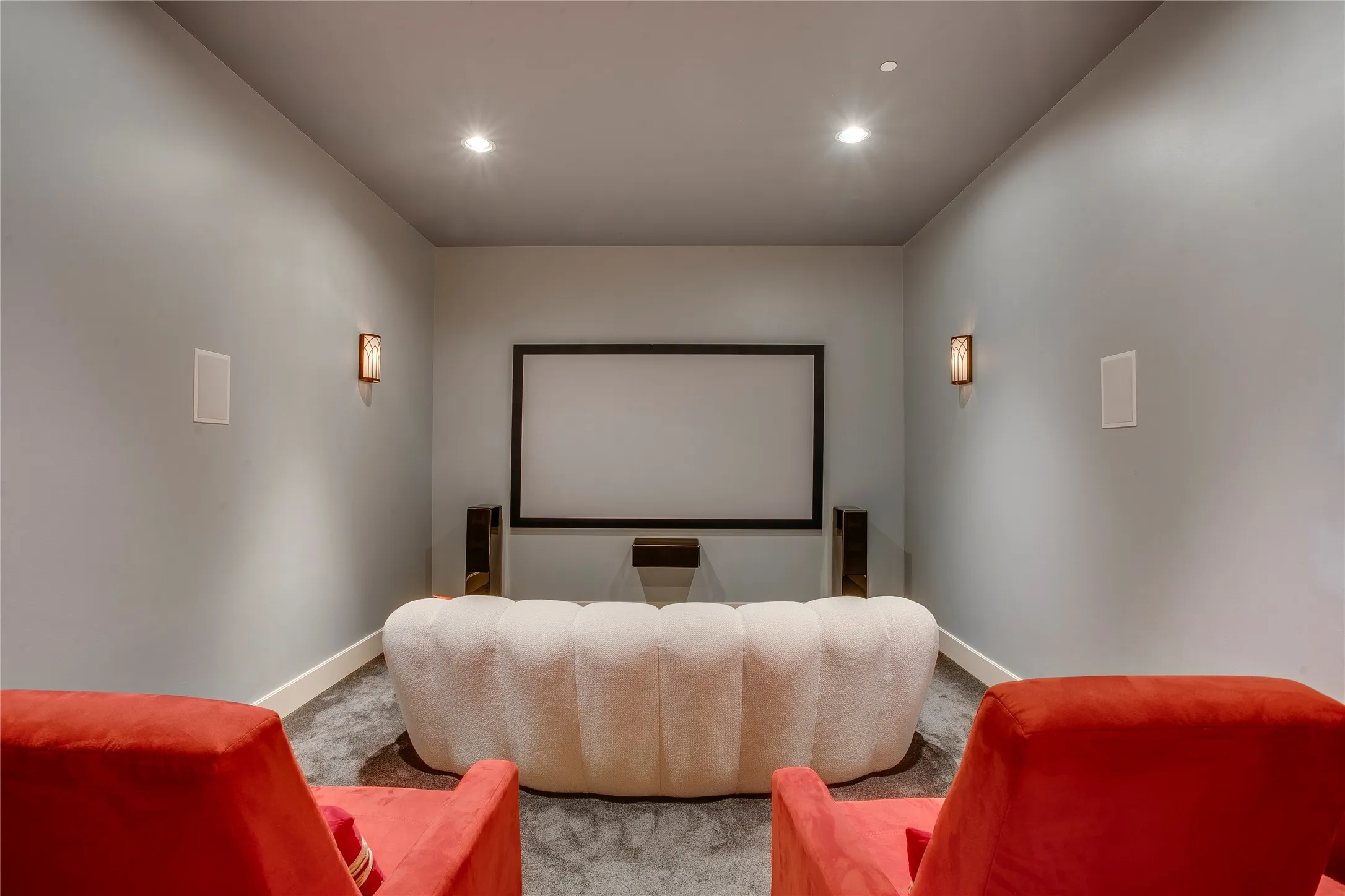 Downstairs media room with upgraded sound insulation for movie nights or game days.