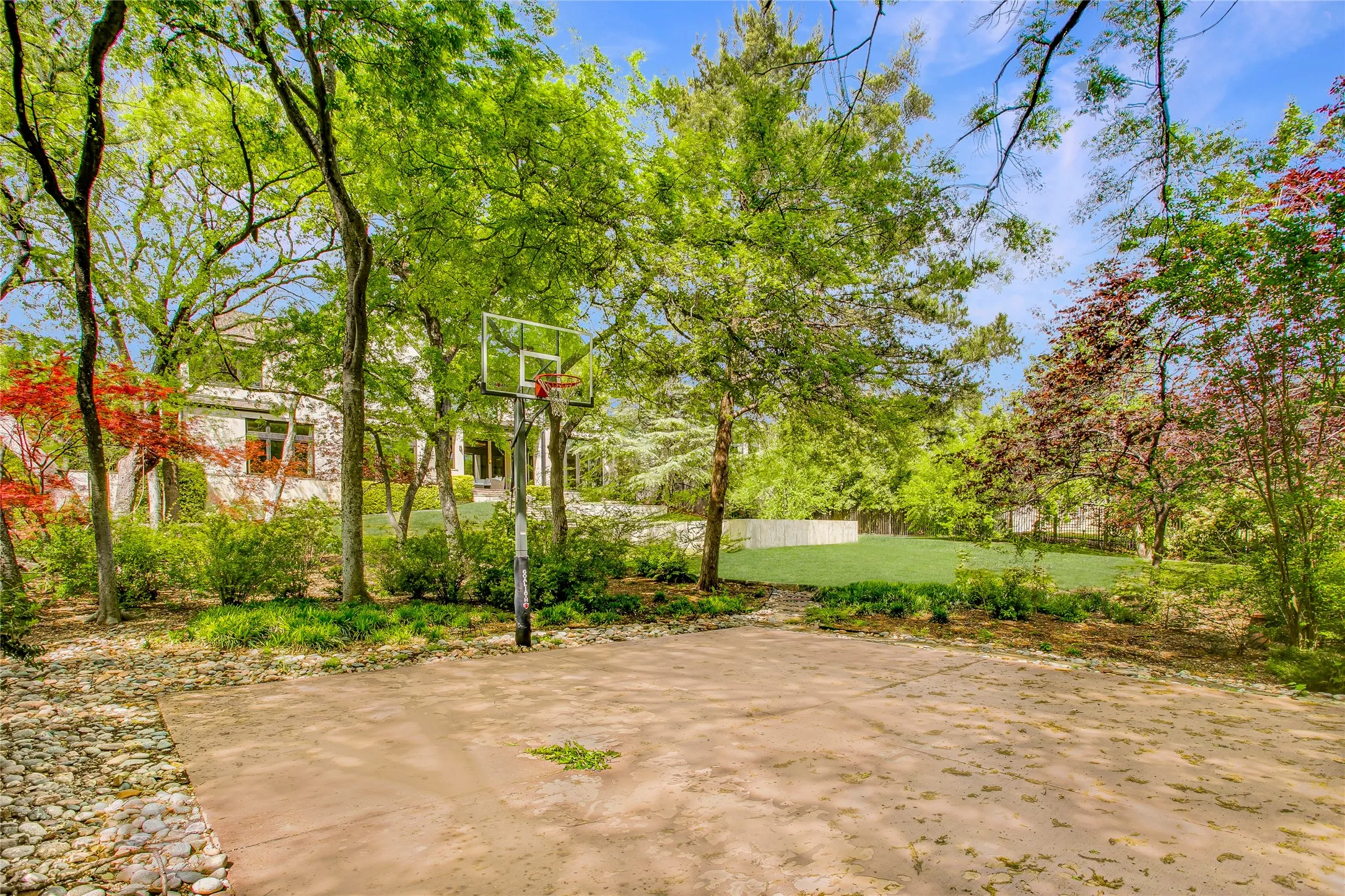 Private basketball court tucked away in the backyard.
