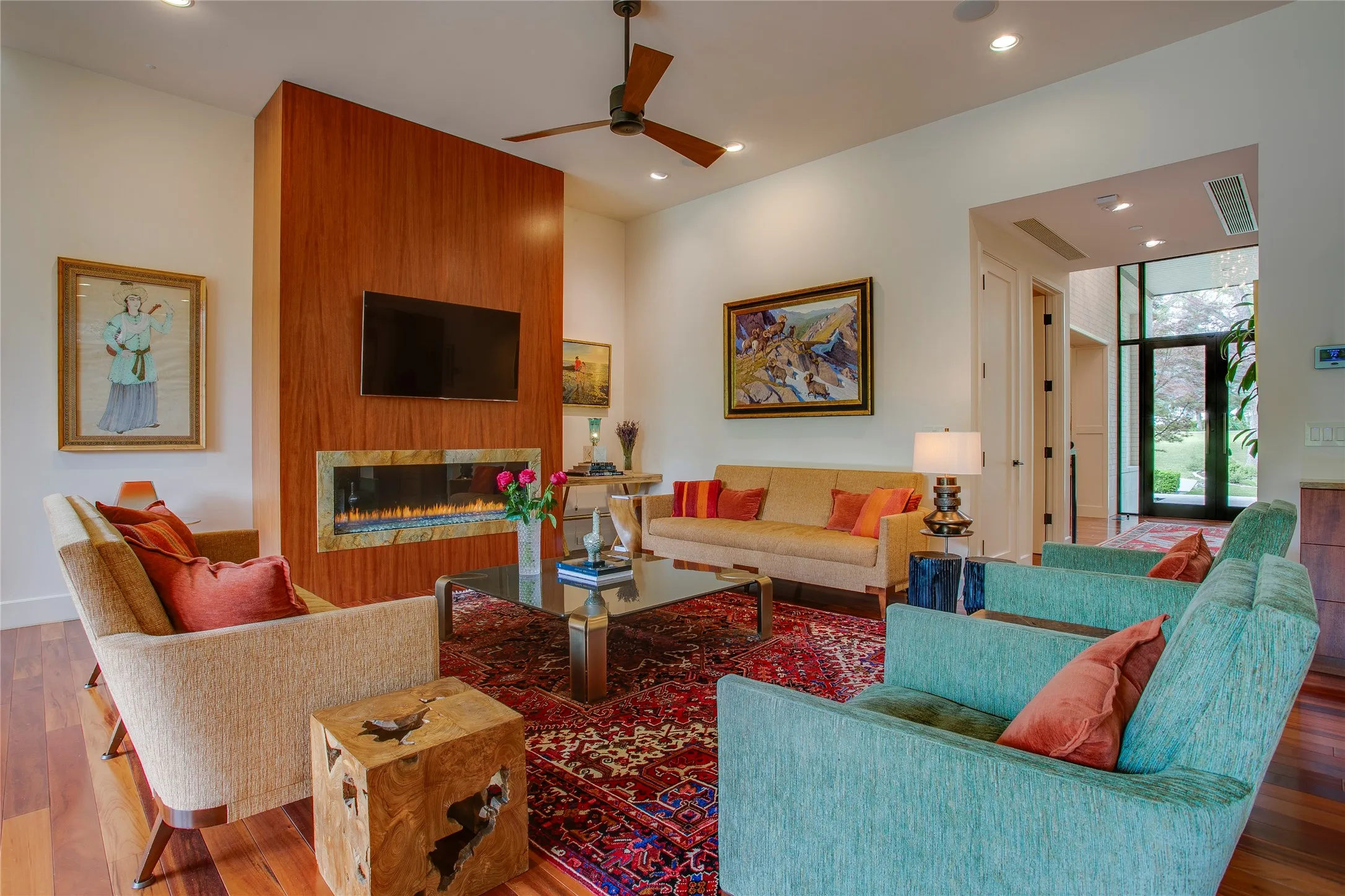 Open floor concept with spacious living room flooded with natural light and gas fireplace.