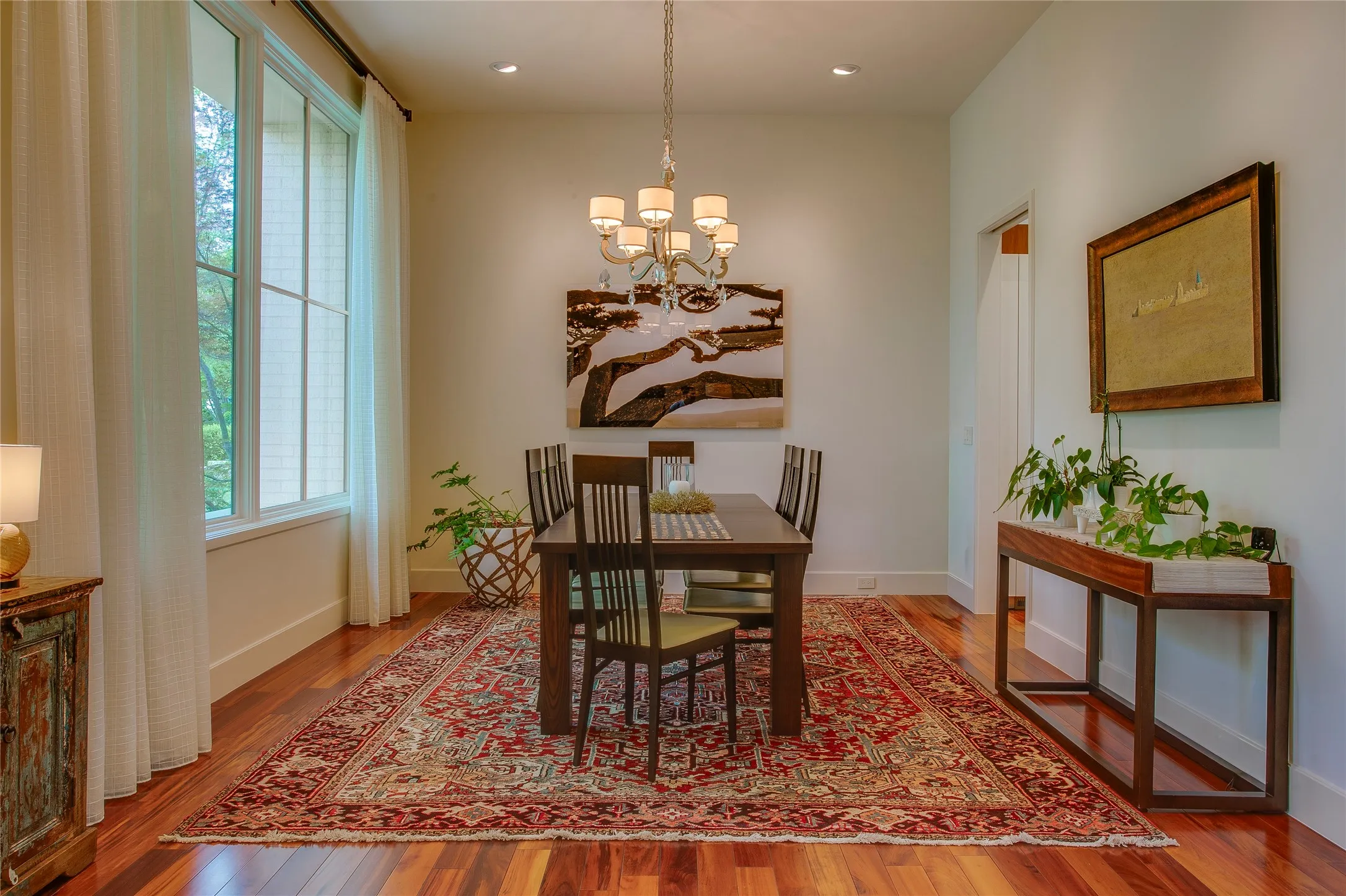 Dining room across from formal living room is connected to the kitchen by a butler's pantry that is perfect as a bar area.