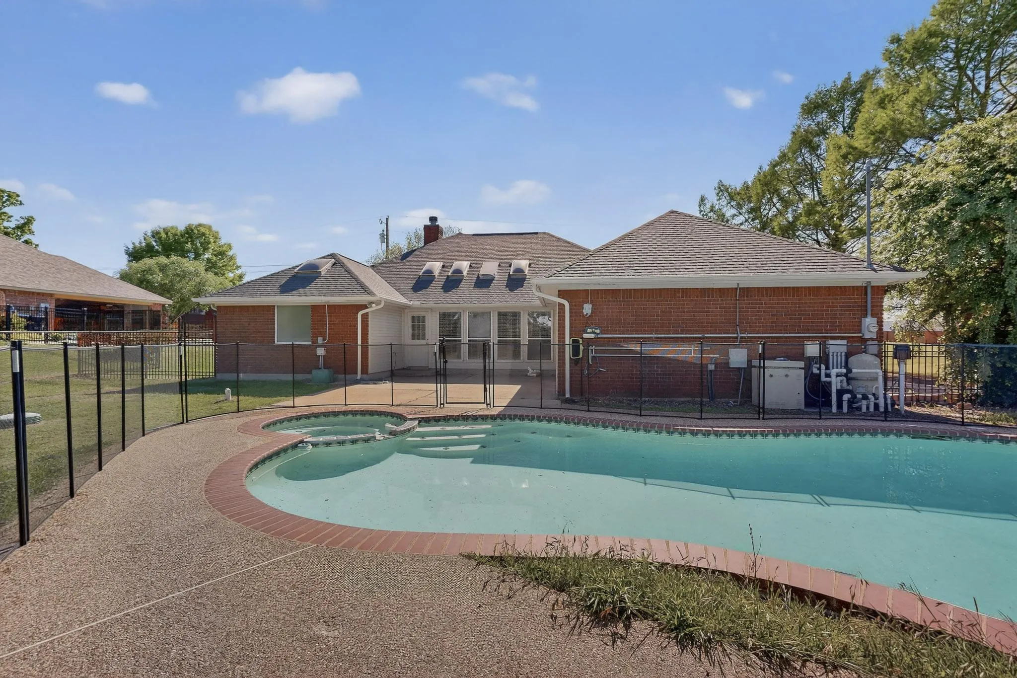Relaxing pool / spa featuring a patio