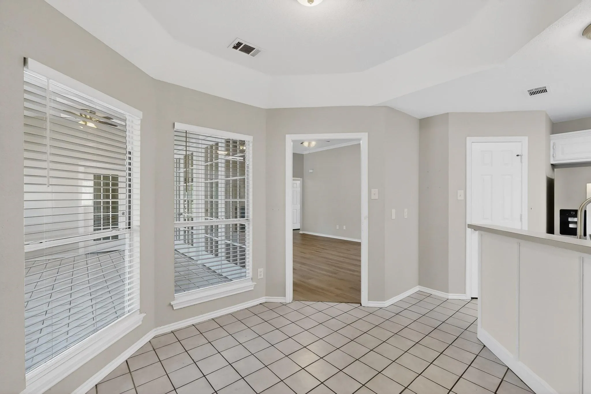 Unfurnished dining area featuring light tile patterned floors
