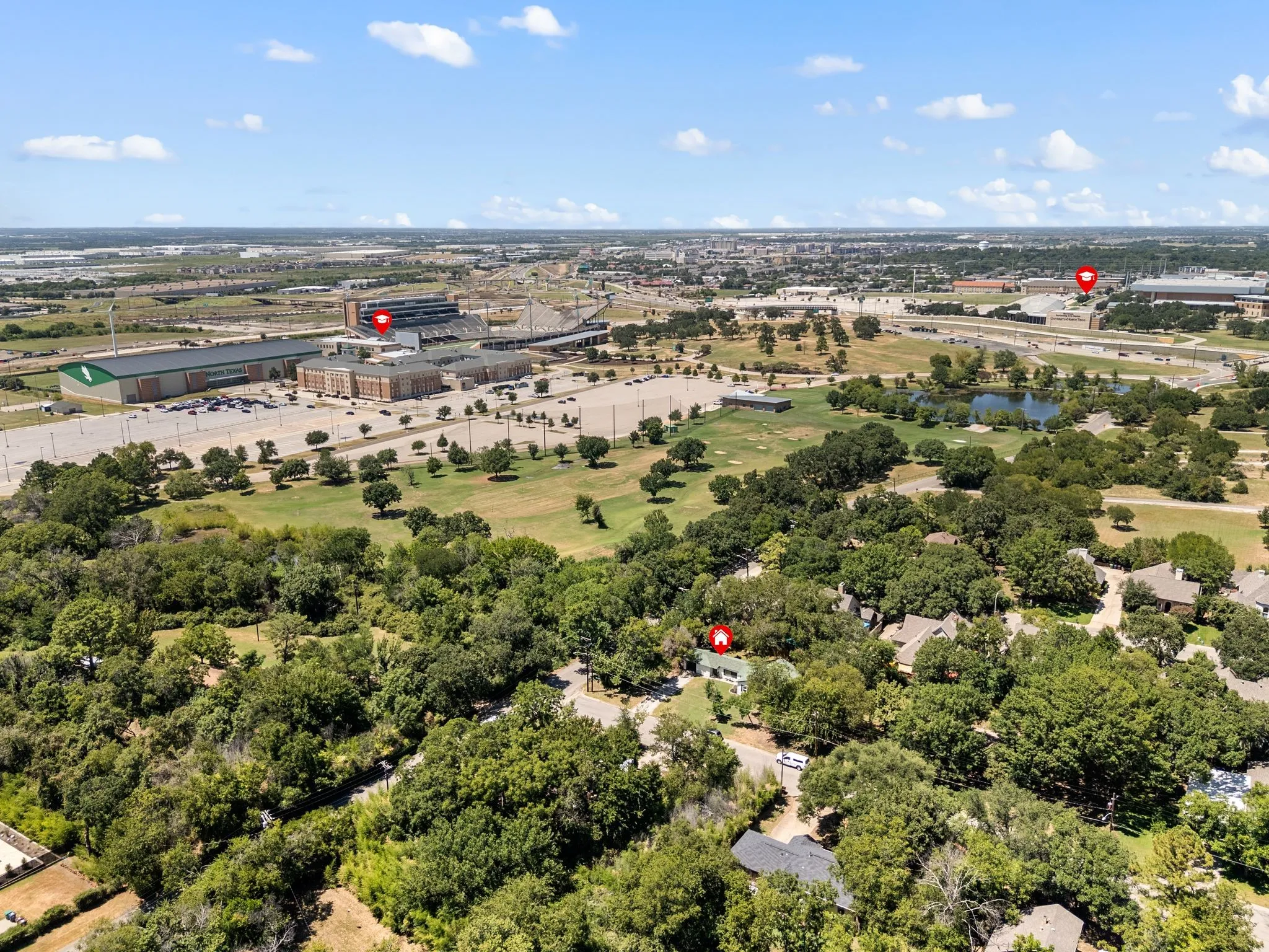 Bird's eye view of a nearby body of water and a golf course