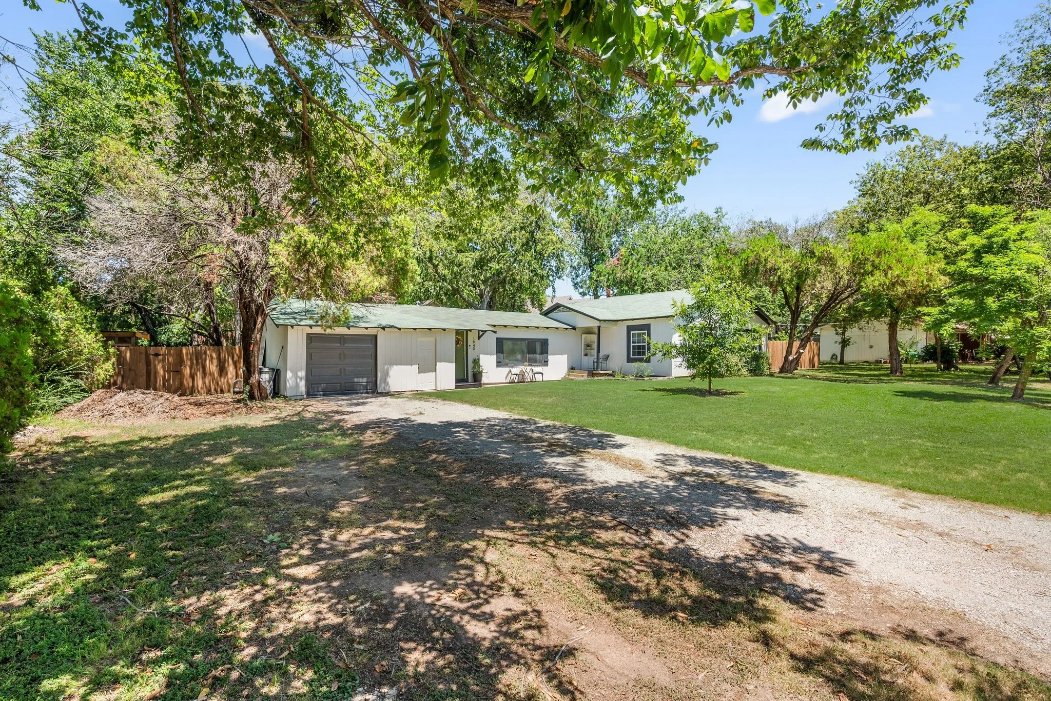 Ranch-style home with driveway and an attached garage