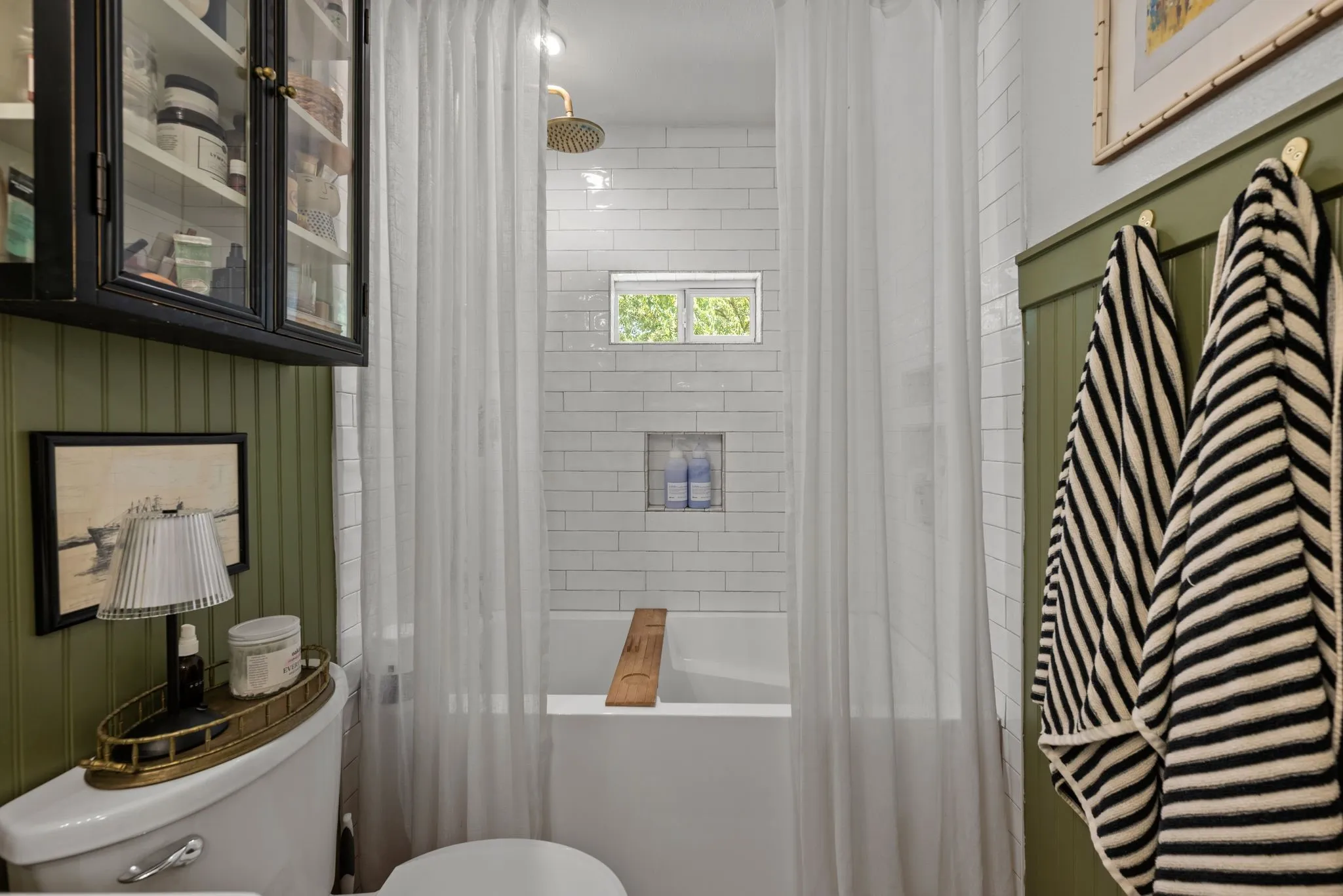 Bathroom with toilet and shower / bath combo