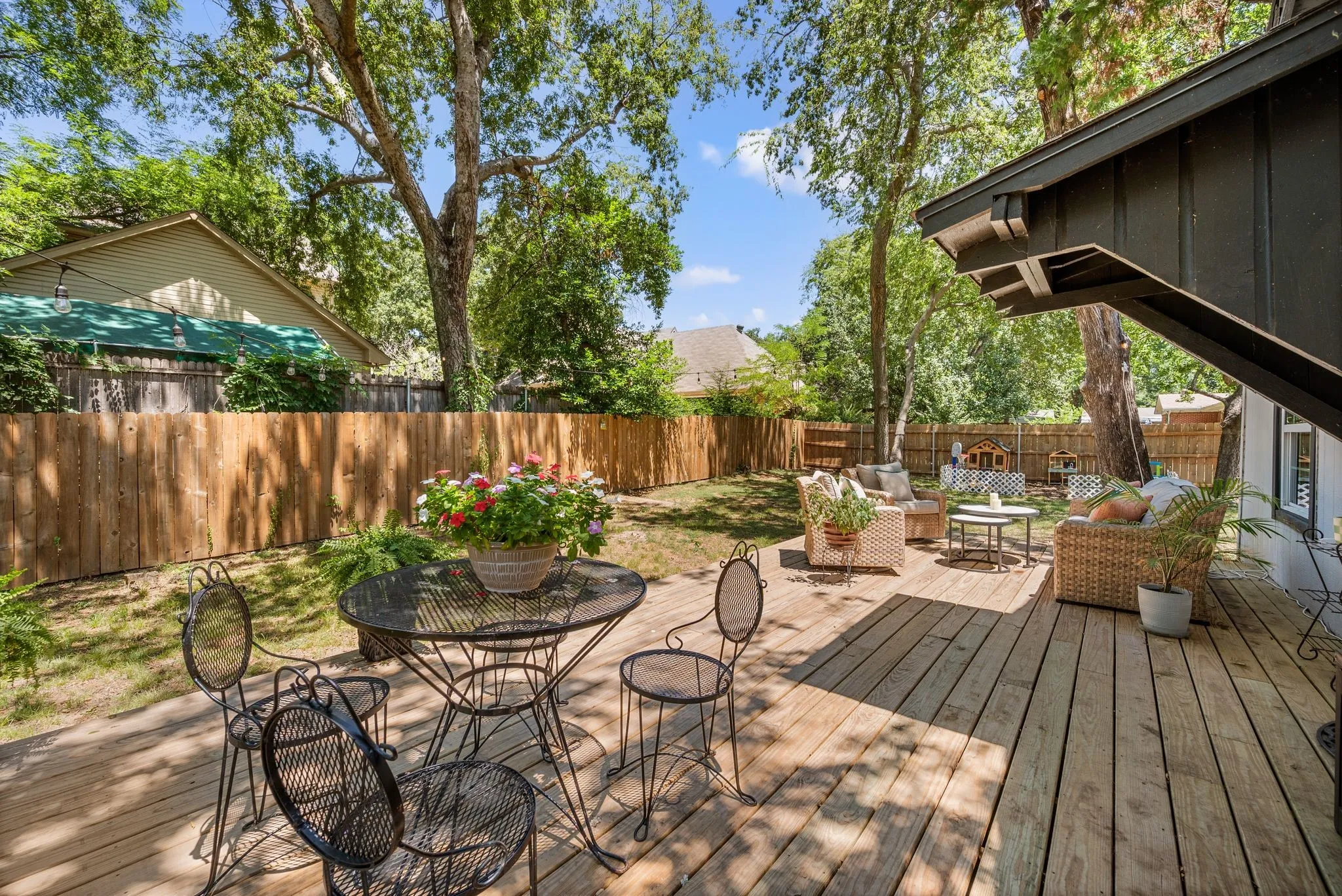 Wooden deck featuring a fenced backyard, an outdoor living space, and outdoor dining area