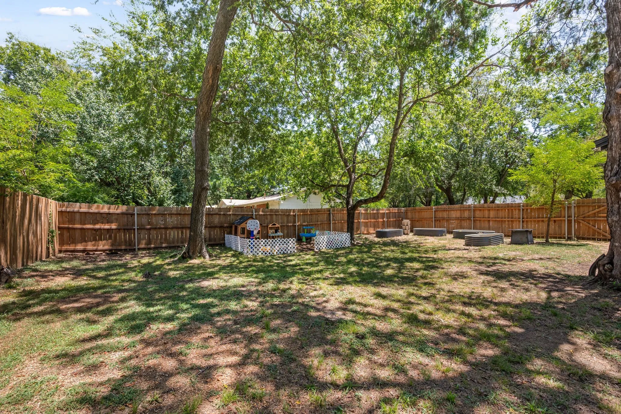 View of fenced backyard
