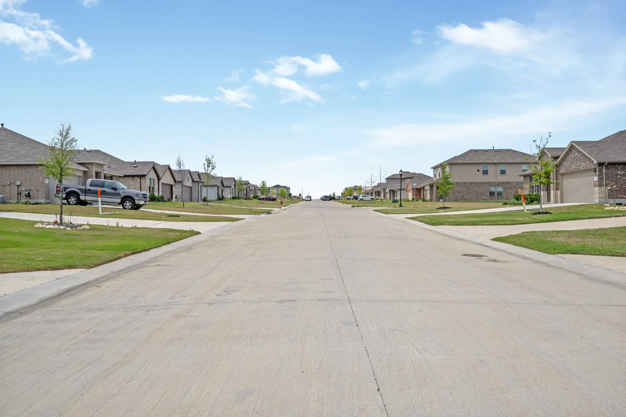 View of concrete street featuring a residential view