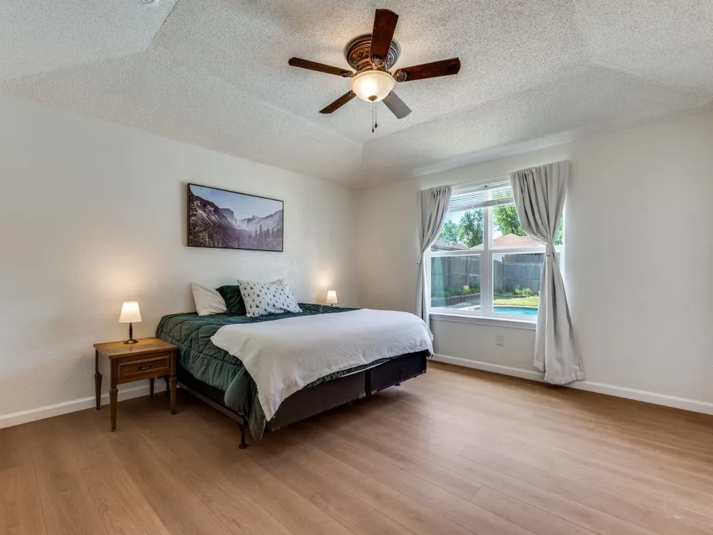 Large primary suite with bright windows
