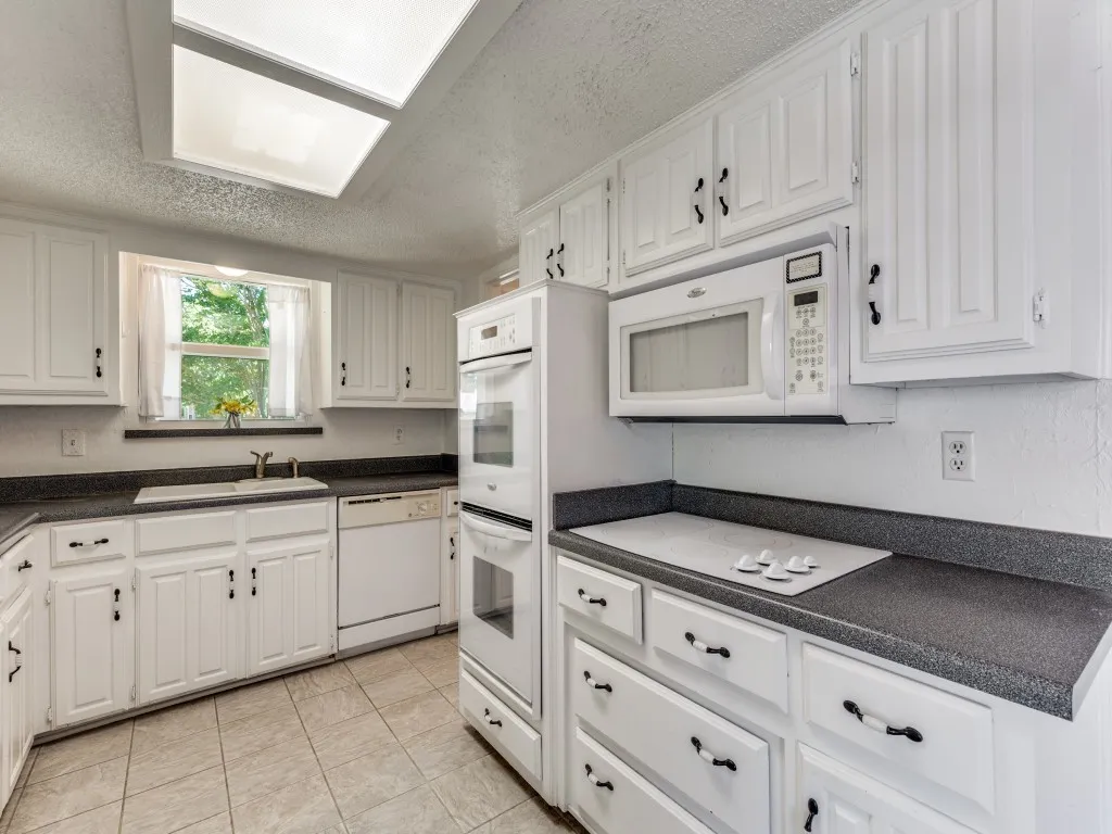 The kitchen features an electric cooktop, and it is plumbed for gas as well.