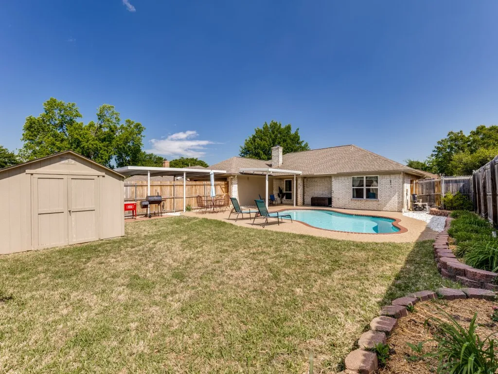 Plenty of yard for pets too. You'll love the large shed for extra storage and the 2-car carport for additional covered parking.