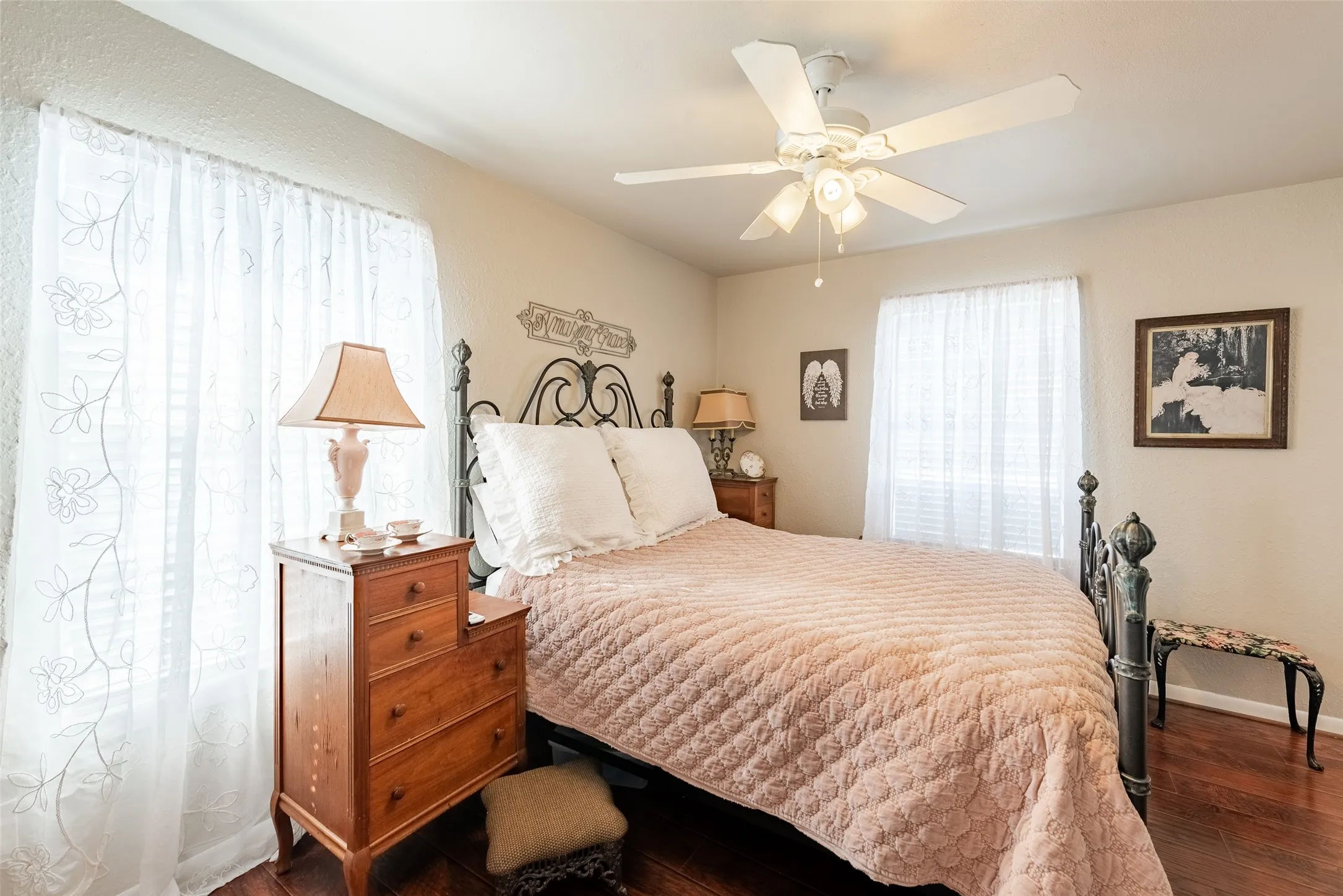 Bedroom featuring dark hardwood / wood-style floors and ceiling fan