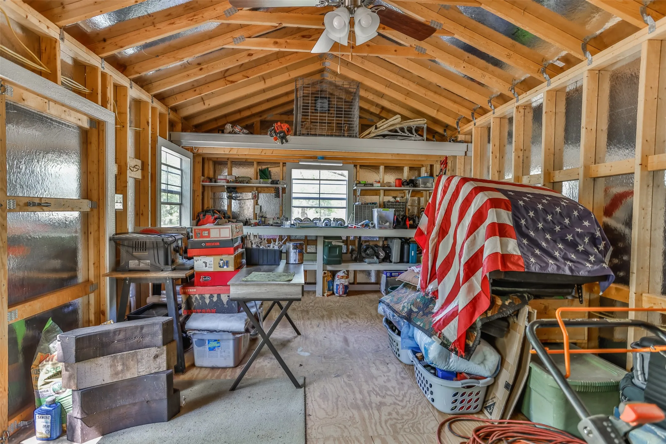 12x24 Storage building inside with electricity, 220 amp, workbench, ceiling fan
