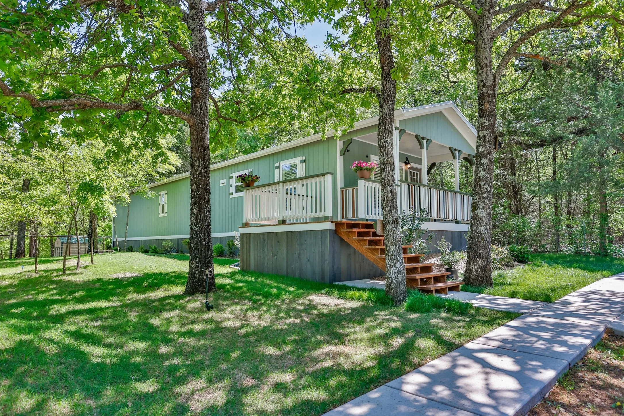 Side view of home with sidewalks and landscaping