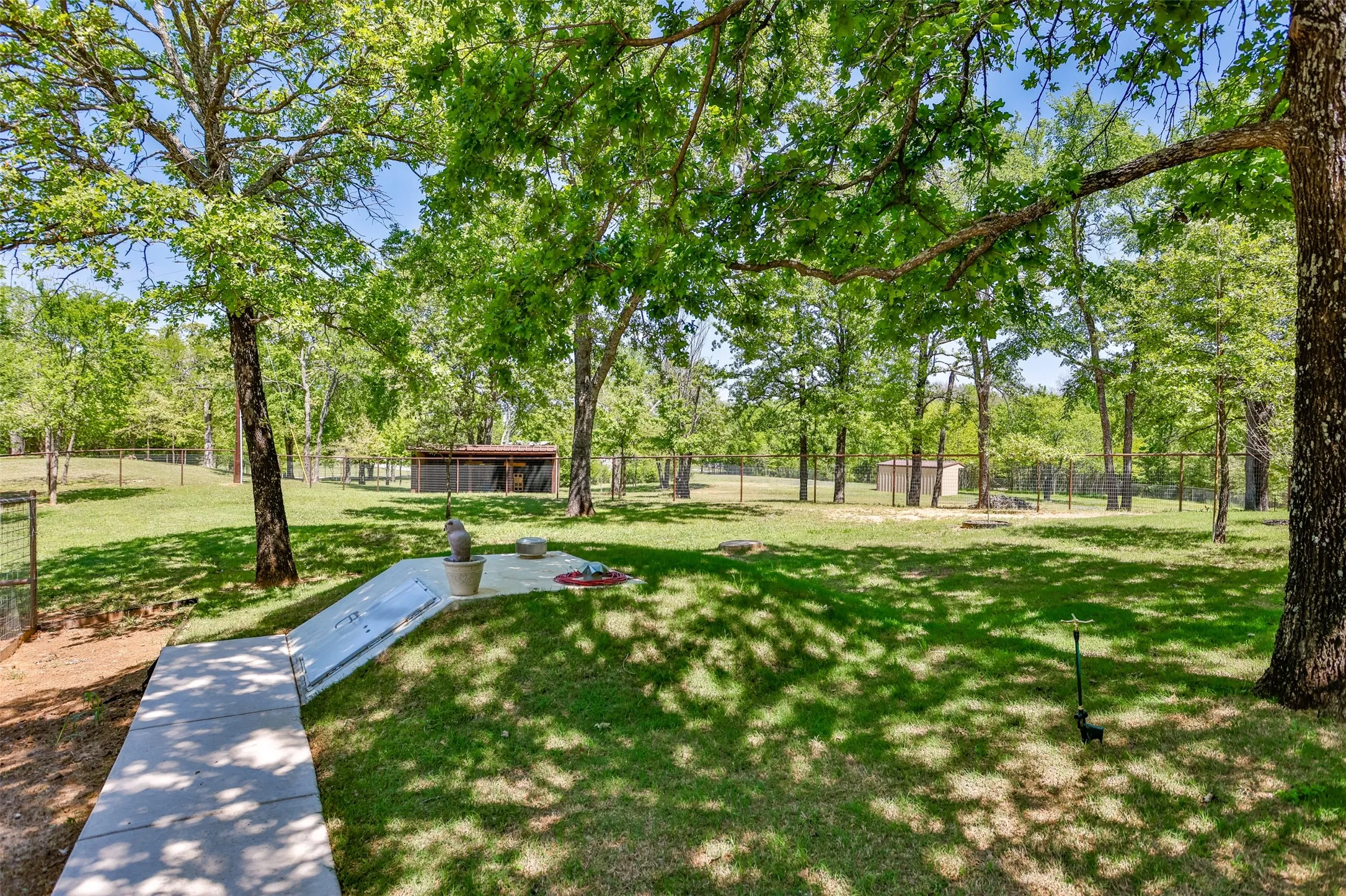 
View of Storm Shelter and concrete sidewalks