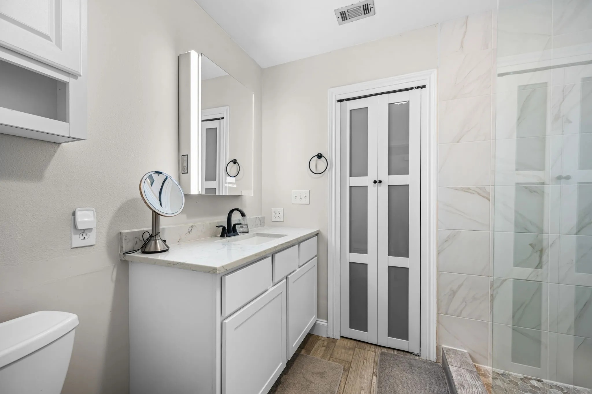 The updated ensuite primary bathroom