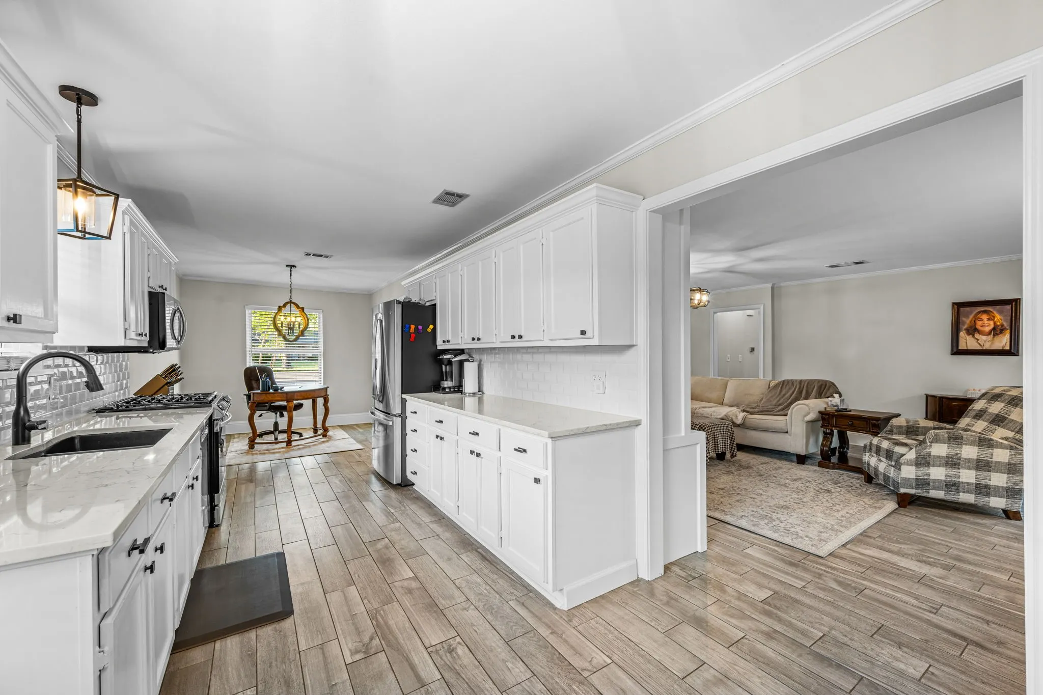 The open floor plan flows seamlessly between the living room and kitchen.