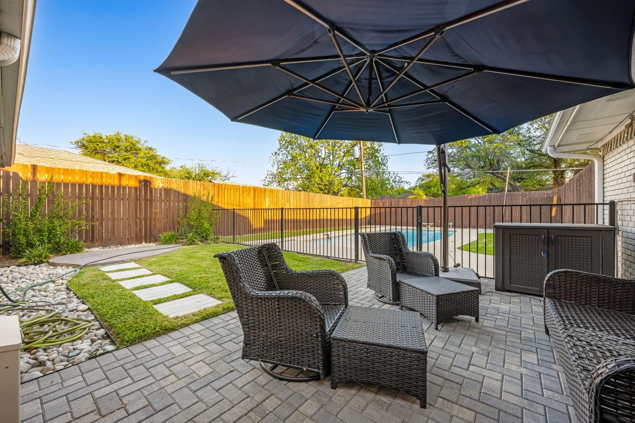 The back patio is a great size. Notice the fence for the pool area.