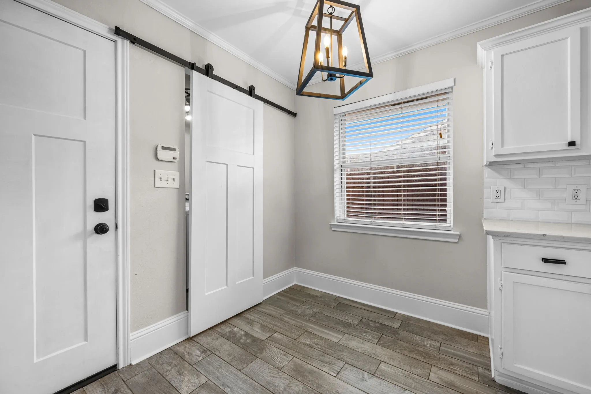 Flexible space at the other end of the kitchen in front of the laundry room.