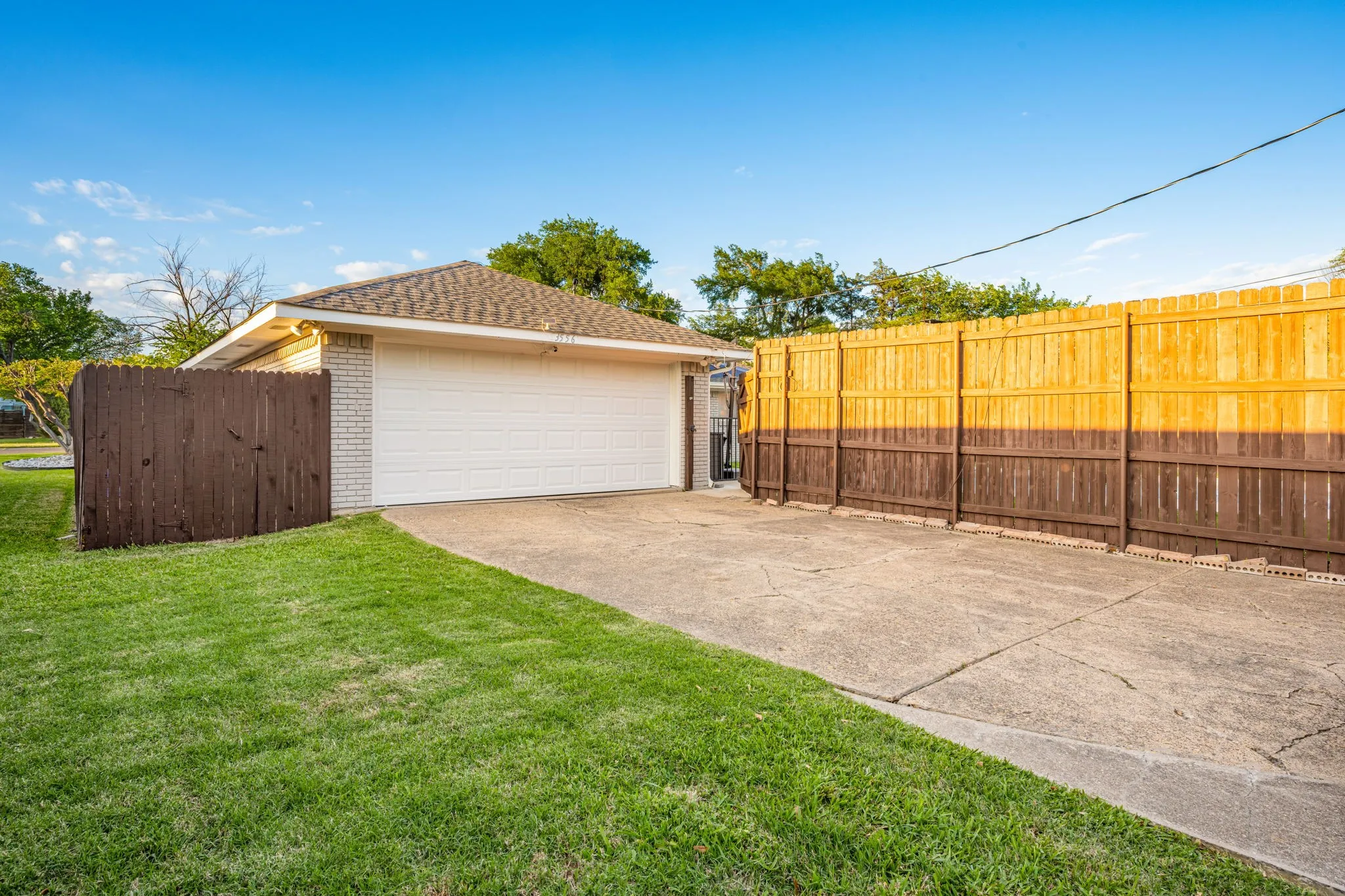 The 2 car garage is in the back with a long driveway for extra parking.