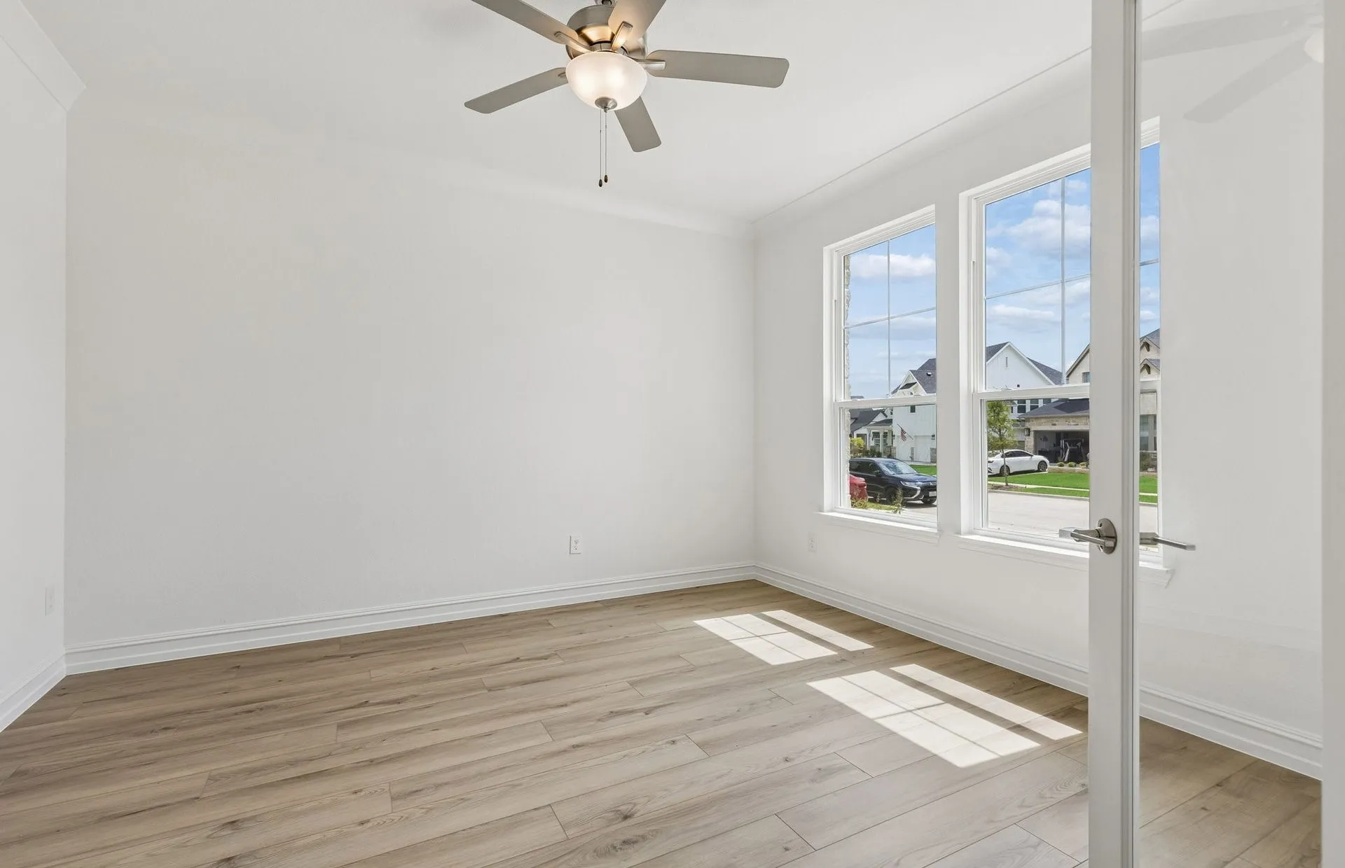 Office off home entry with large windows
