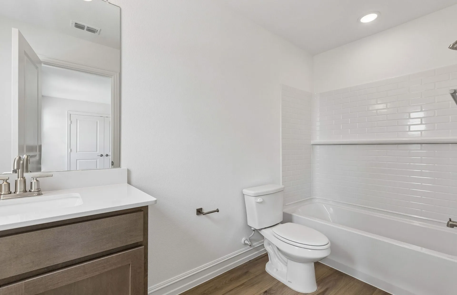 Secondary bath with tile surrounded shower