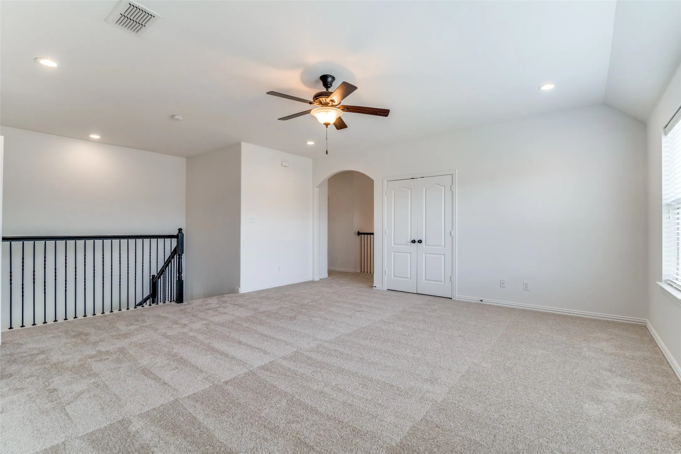 Uptirs gameroom featuring carpet, recessed lighting, ceiling fan, arched walkways, and vaulted ceiling
