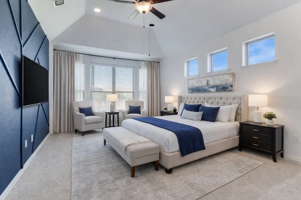 Bedroom with carpet floors, ceiling fan, vaulted ceiling, and recessed lighting