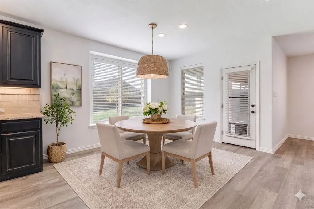 Dining room featuring light wood-type flooring and recessed lighting