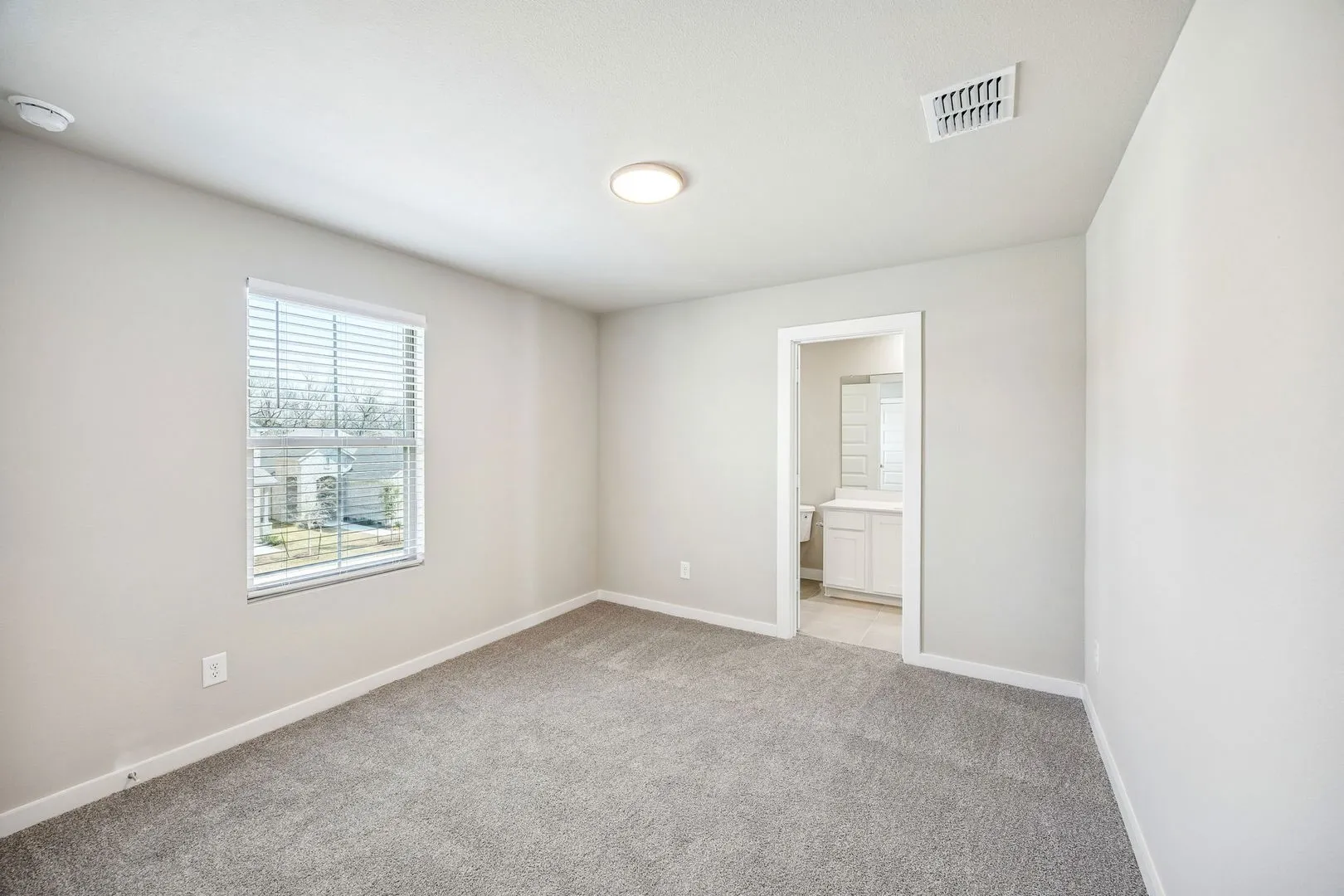 Bedroom in the Willow home plan by Trophy Signature Homes – REPRESENTATIVE PHOTO