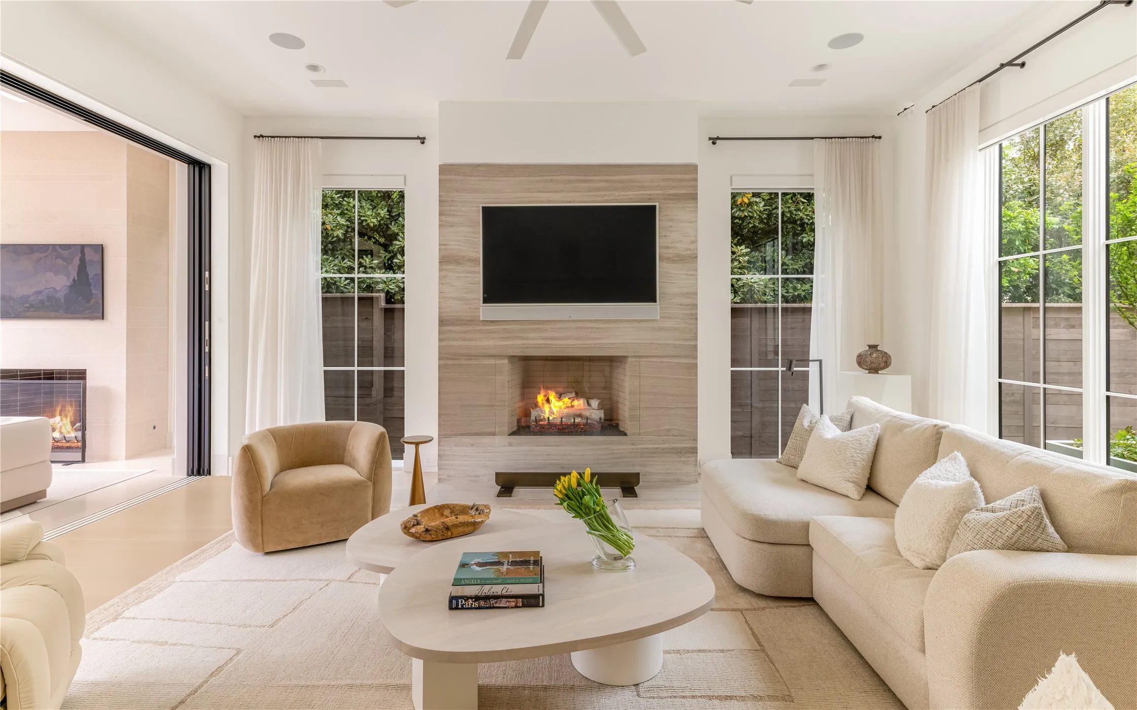 Family Room with Isokern gas fireplace and sliding doors to sunroom